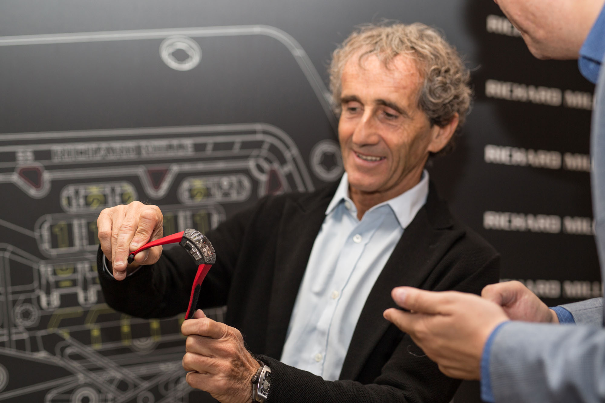 Alain Prost showing off the new RM70-01 watch