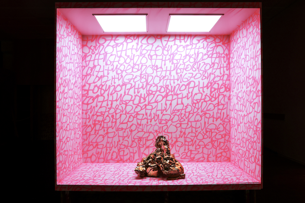 Fredrik Nielsen - A clump of gold in a pink room with doodles on the walls