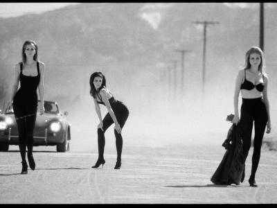 Photo London - three women standing on a road with black dresses and bras