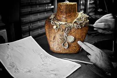 Working on <a href="https://uk.boucheron.com/en_gb/the-creations/high-jewelry/l-artisan-du-reve/bouquet-d-ailes.html" target=”_blank”>Boucheron’s “Bouquet d’Ailes</a> necklace, to be set with emeralds, sapphires and diamonds bouchero