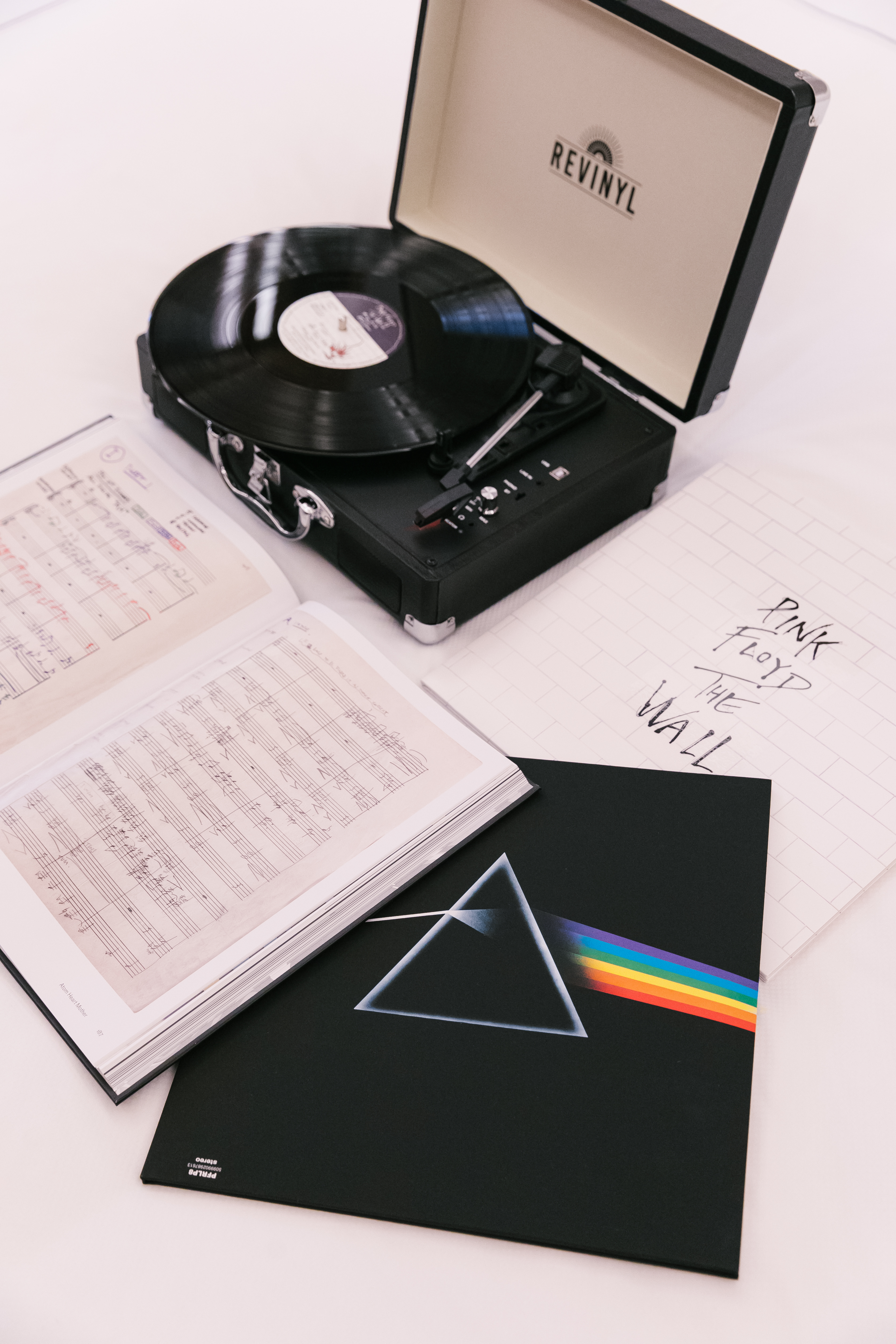 an old school record player and a collection of the band’s vinyl records