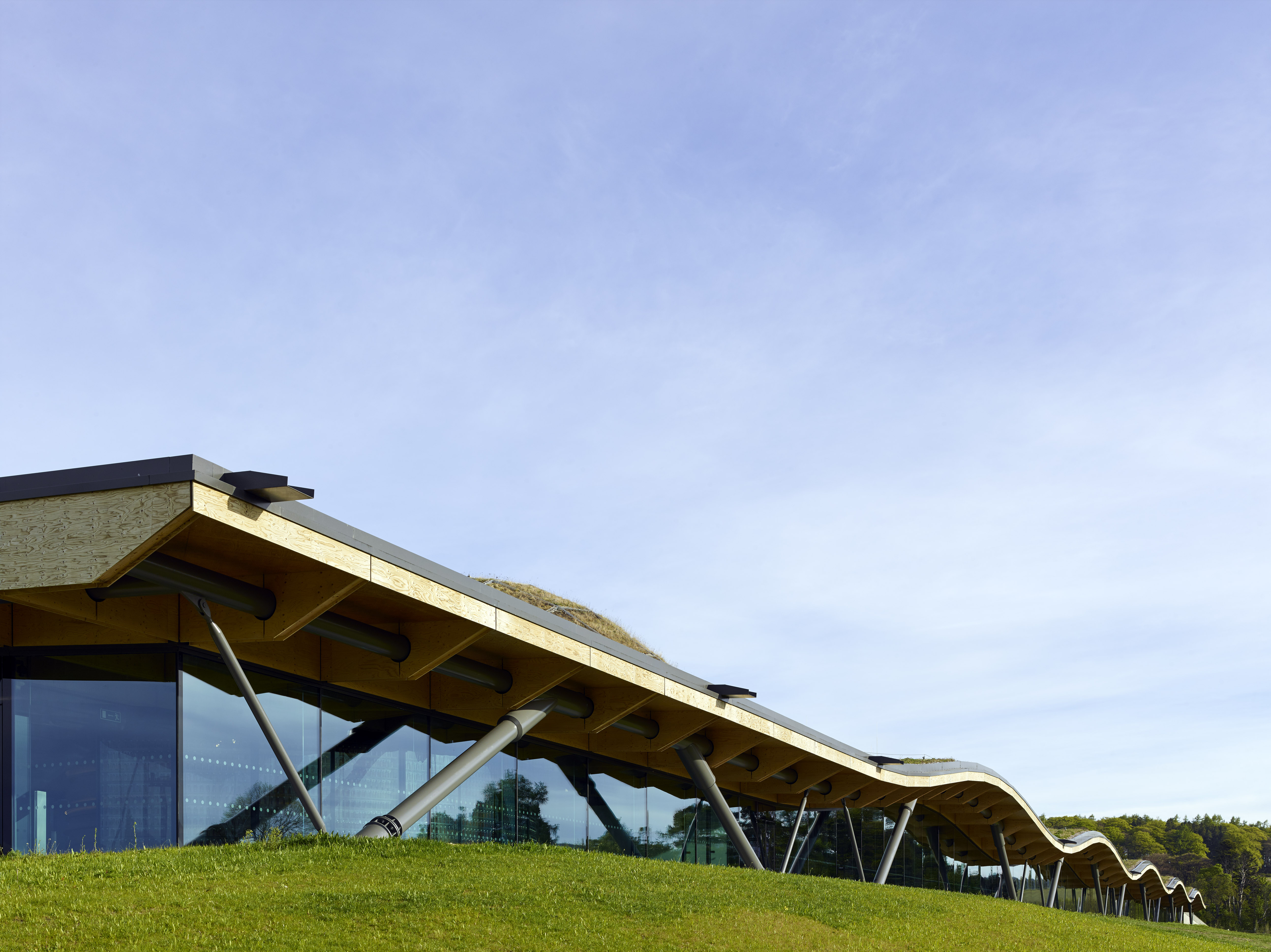 The undulating roof blends seamlessly into the landscape The undulating roof blends seamlessly into the landscape