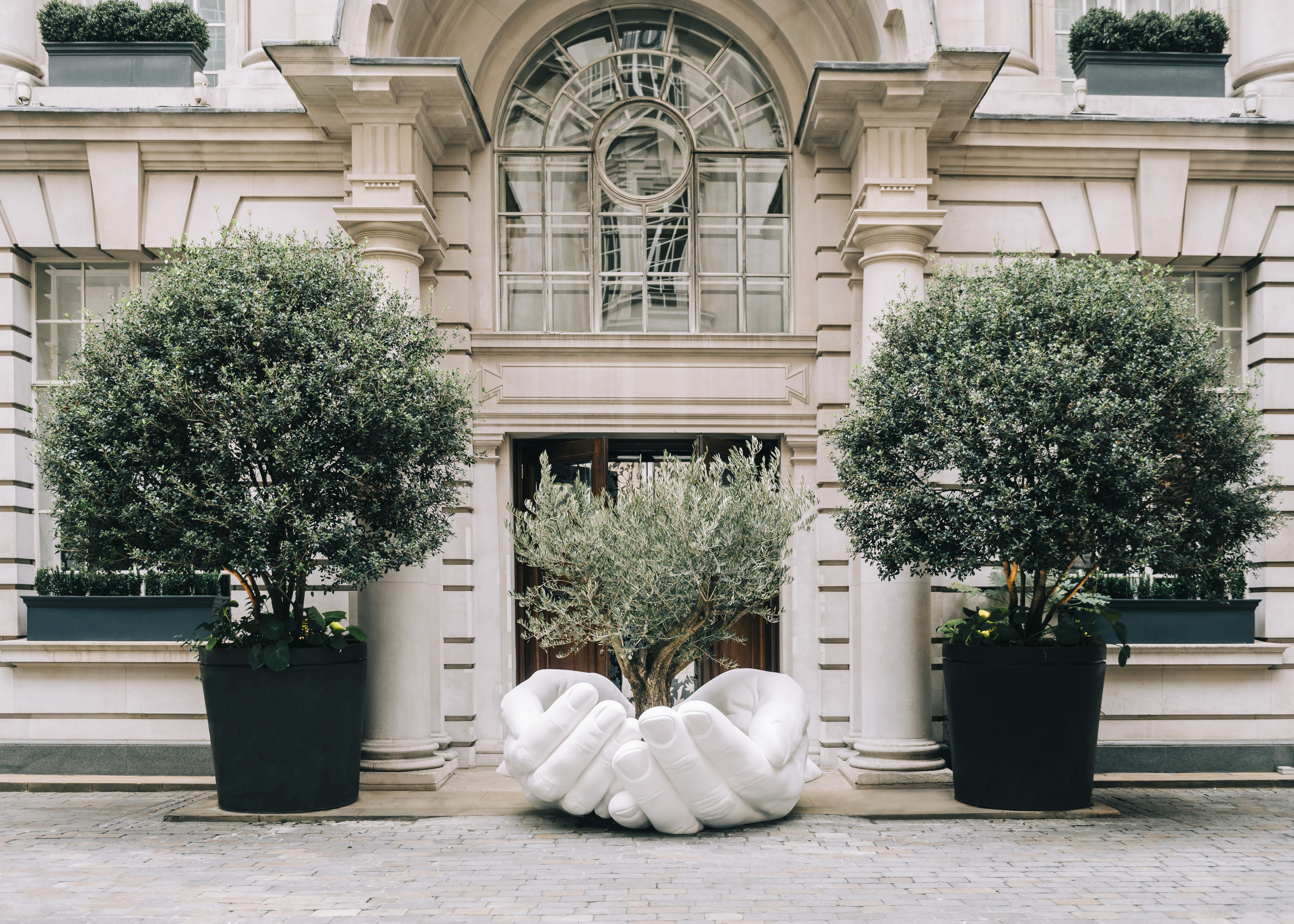 Marine Tanguy's curation as PlaceMaker at Rosewood London Lorenzo Quinn's 'Give' sculpture at Rosewood London