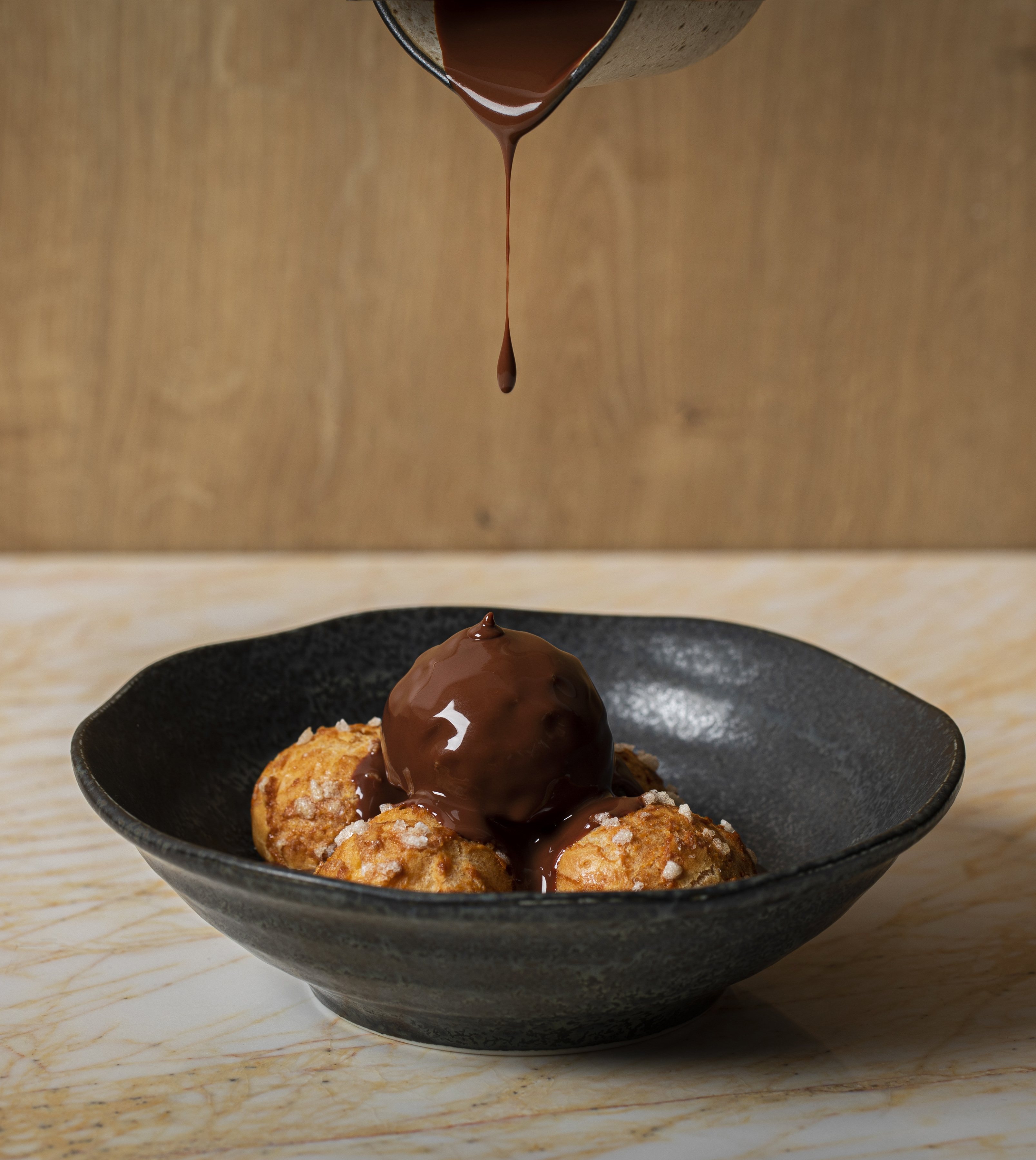 Profiteroles with chocolate sauce and Chantilly cream.