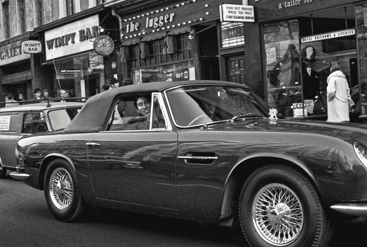 Prince Charles driving his Aston Martin