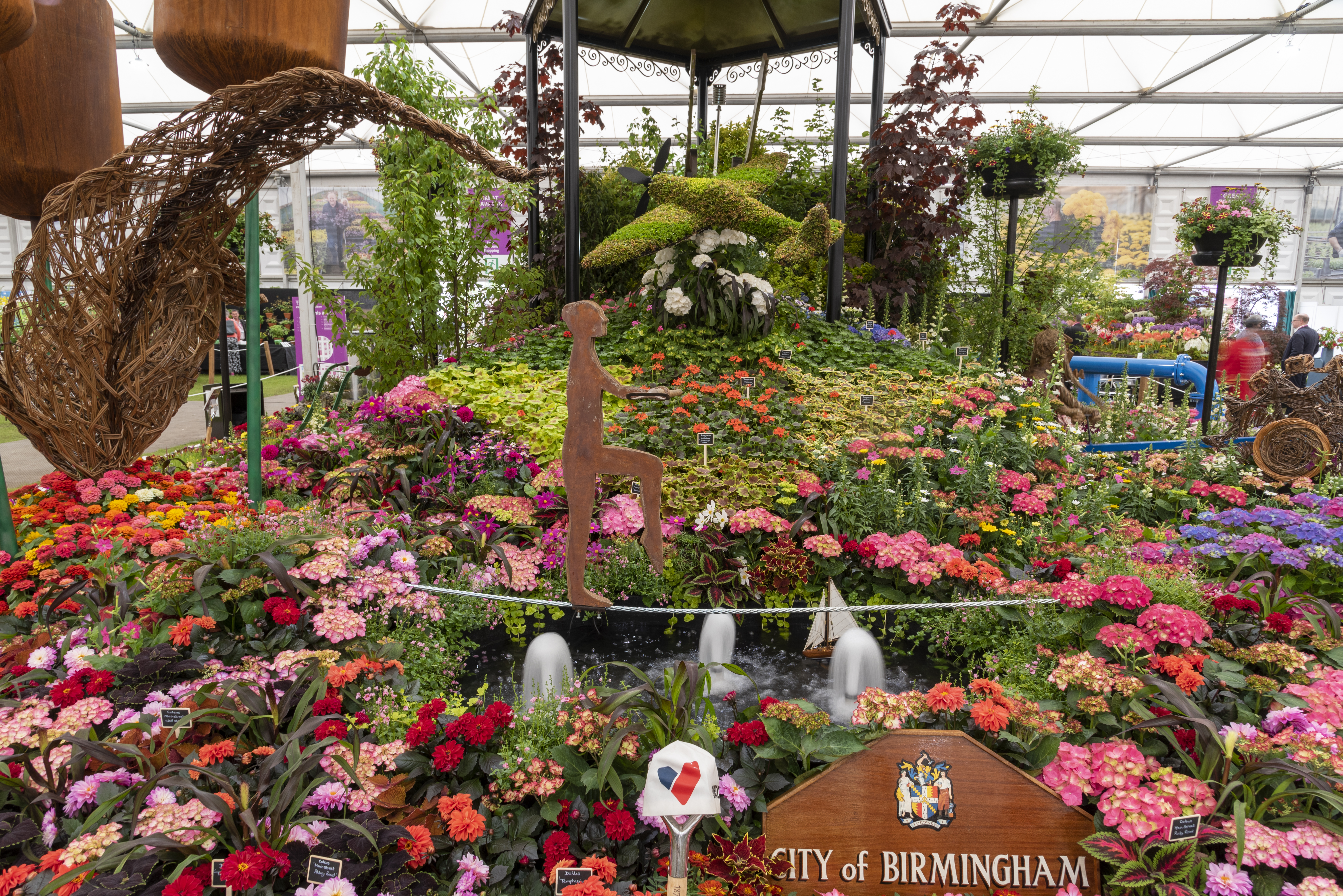 Birmingham Stand Chelsea Flower Show Birmingham Stand - flowers and plant installations surrounding a plaque for the city of Birmingham