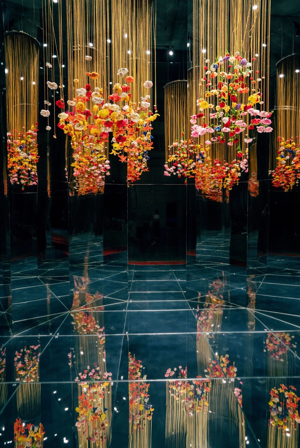 Chinese Design: Colourful dangling lights with flowers which reflect on the blue ground