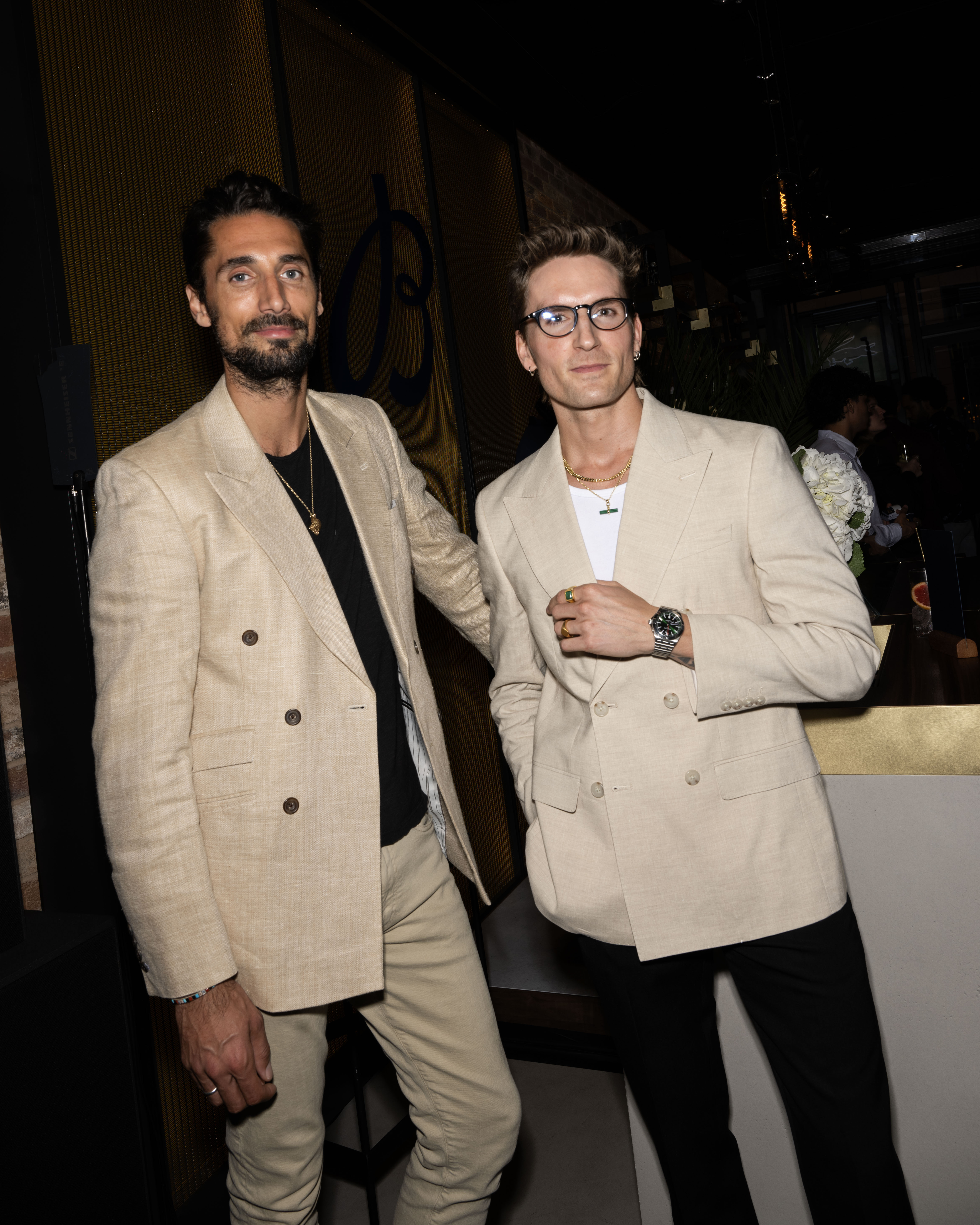 Breitling - Hugo Taylor and Oliver Proudlock Breitling - Two men wearing beige and black