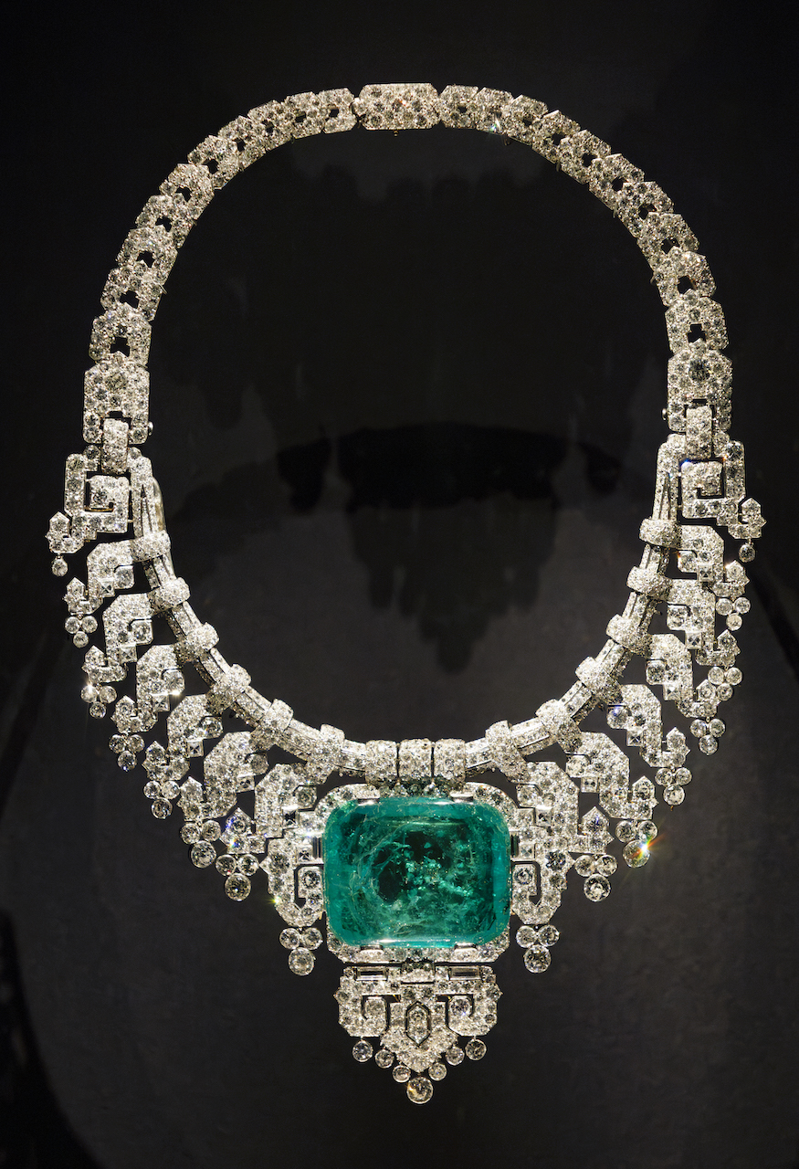 Cartier diamond necklace with a large emerald stone in the centre, on display at the V&A.