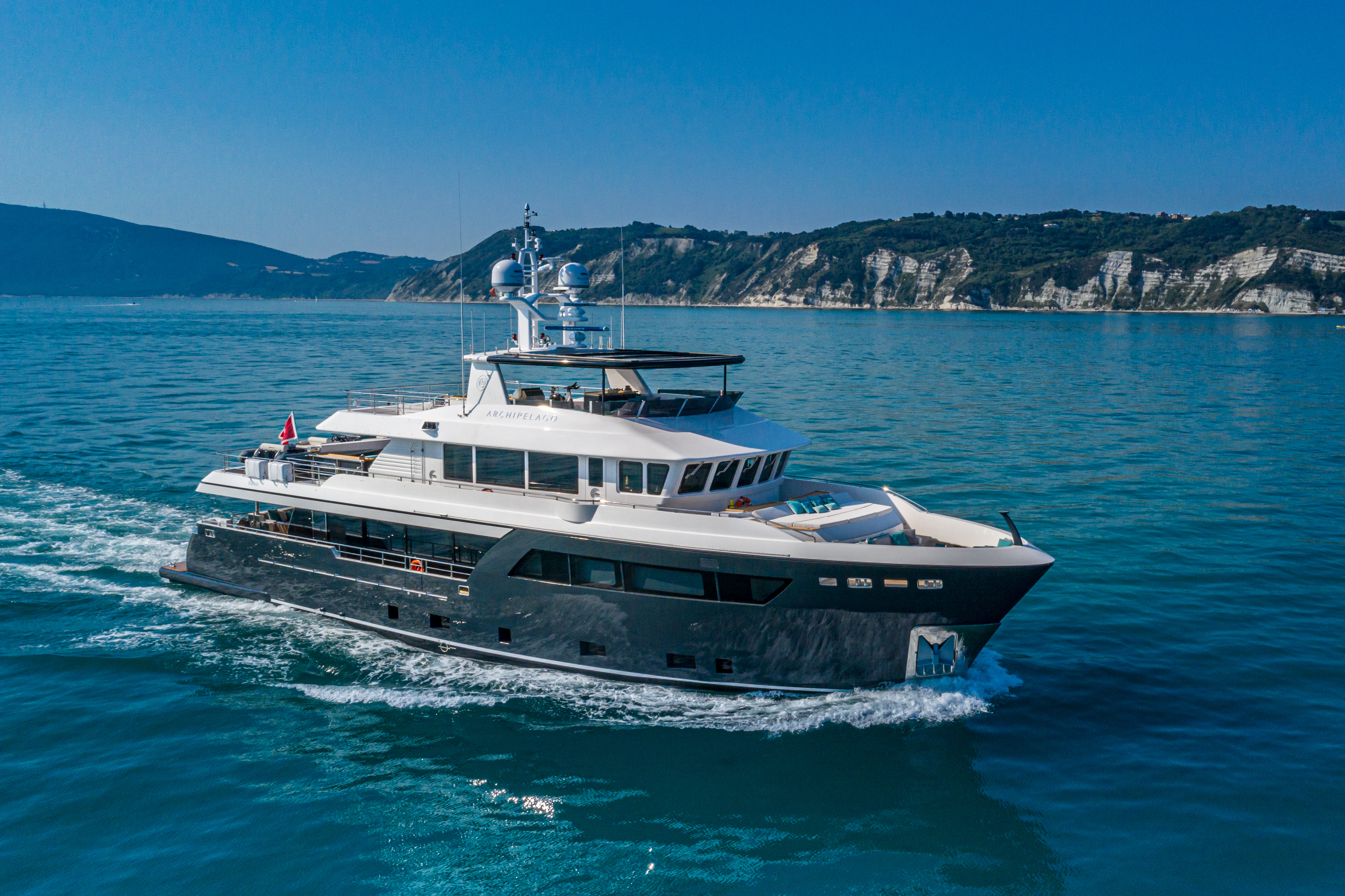 One of Cantiere delle Marche's silent superyachts, moving through turquoise waters.