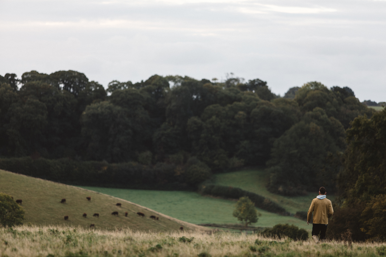 Nicholas Balfe, Chef Director of HOLM, jogging through a field foraging for ingredients.