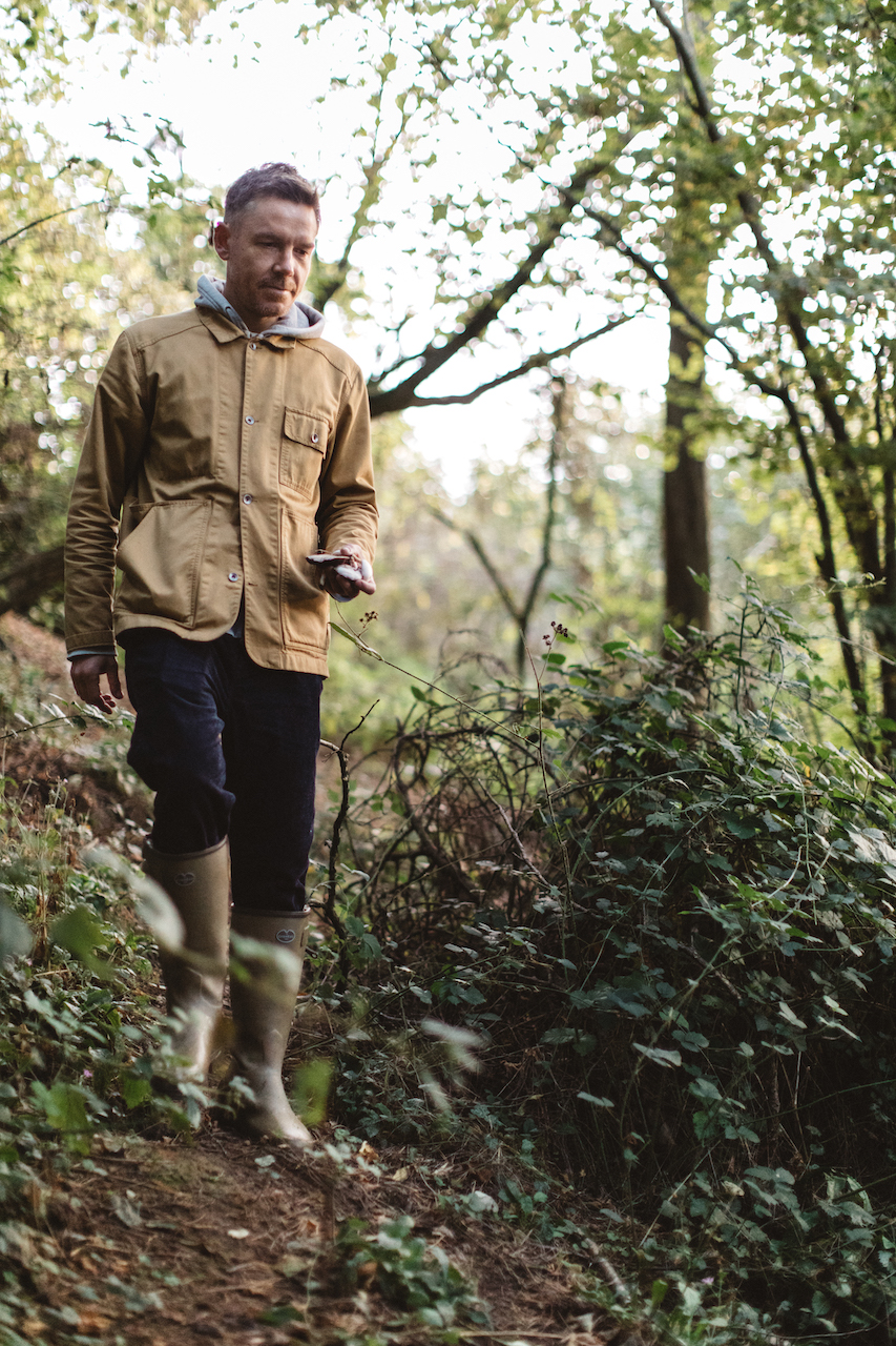 Nicholas Balfe, Chef Director of HOLM, walking through a forest foraging ingredients.