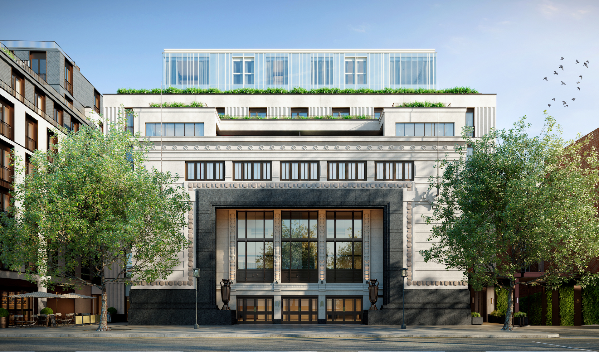 The Art Deco entrance of Holland Park Gate, one of the luxury properties in London, with greenery either side.