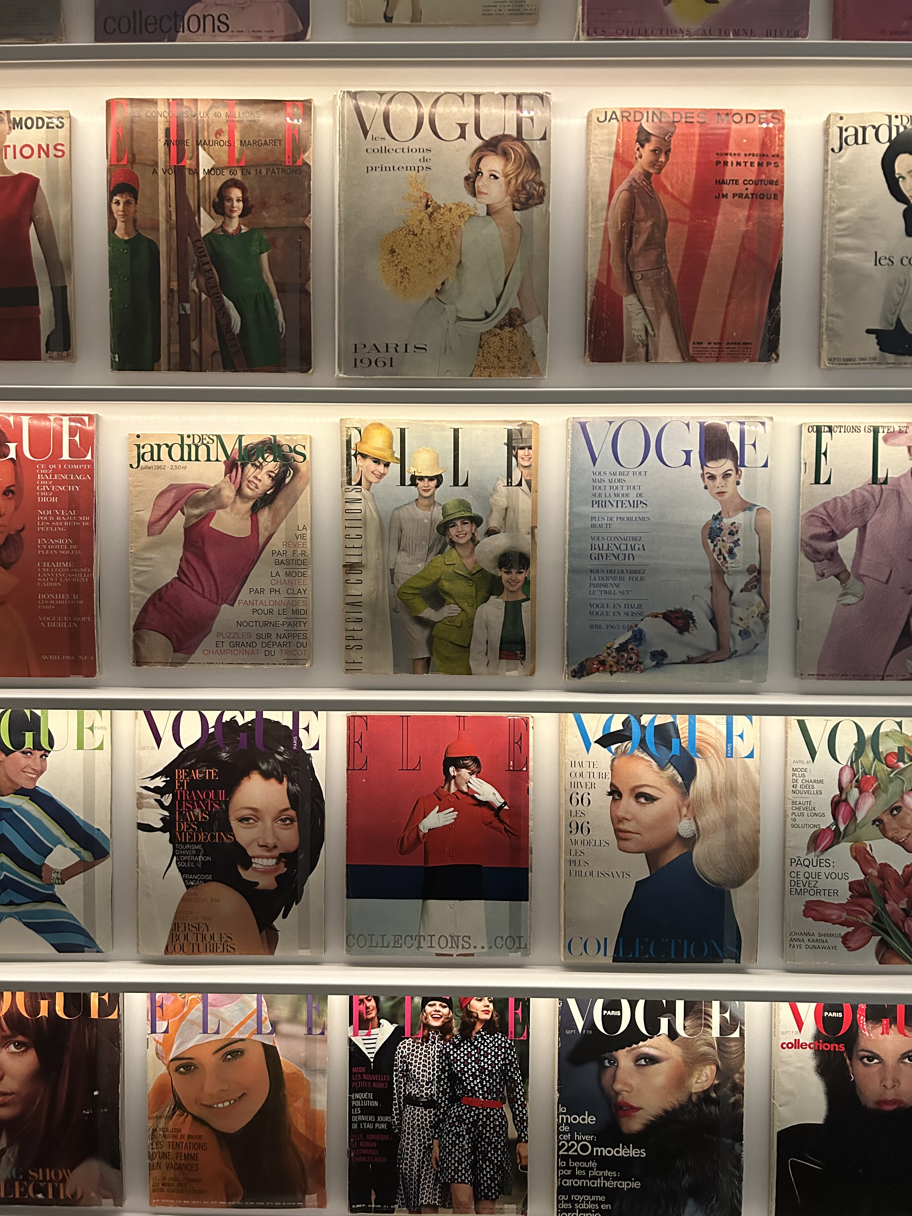 A display of fashion magazines including Vogue and Elle magazine exhibited at La Galerie Dior in Paris.