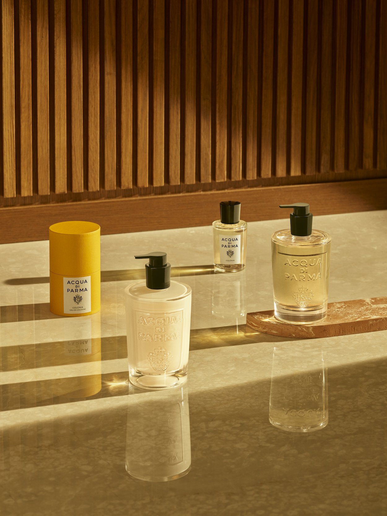 Luxury Fragrance Industry - One cologne from the luxury fragrance brand Acqua di Parma with the packaging and Acqua Di Parma hand soap and hand cream.