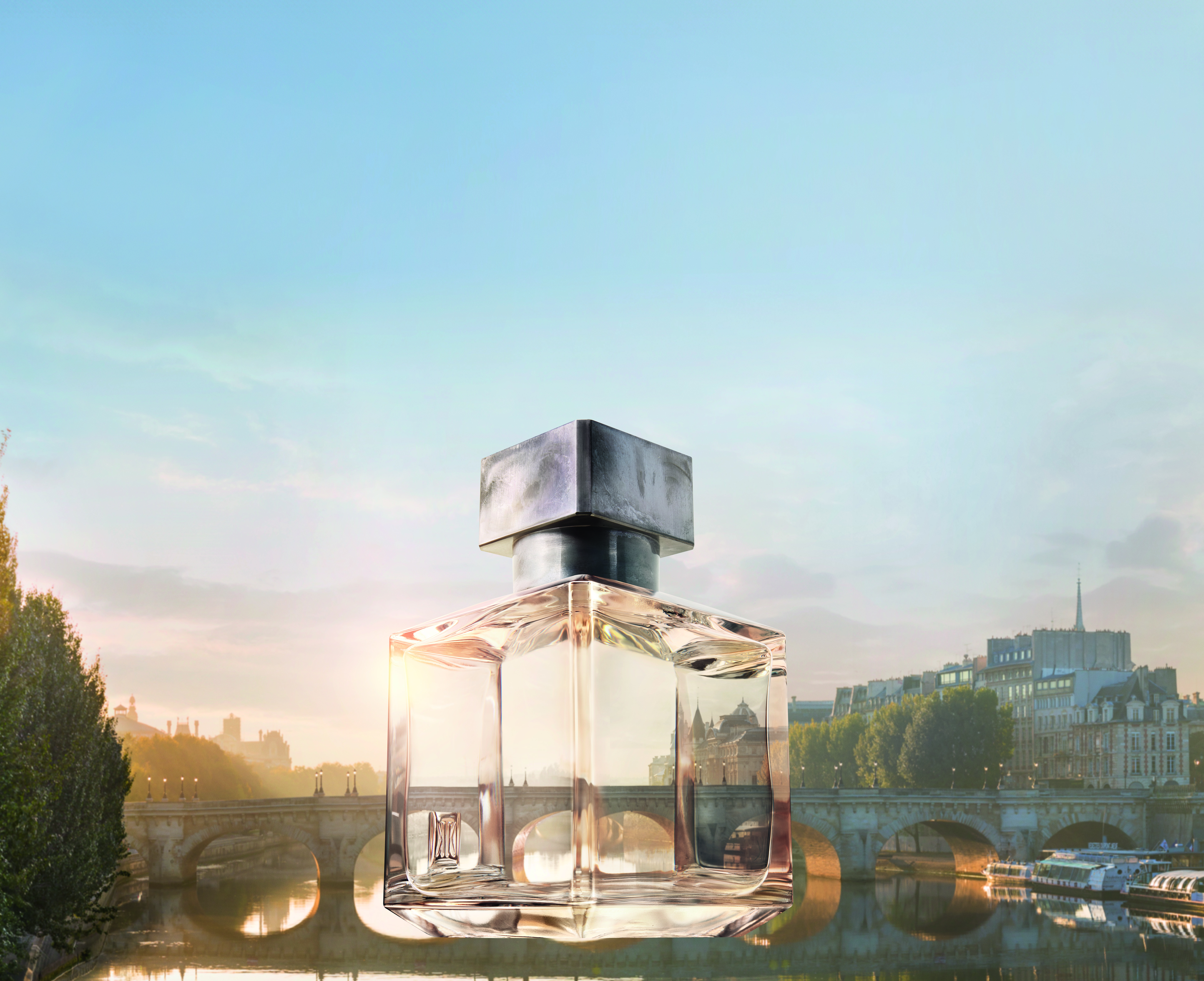 Luxury Fragrance Industry - A bottle of Petit Matin fragrance by Maison Francis Kurkdjian floating above the Seine river.
