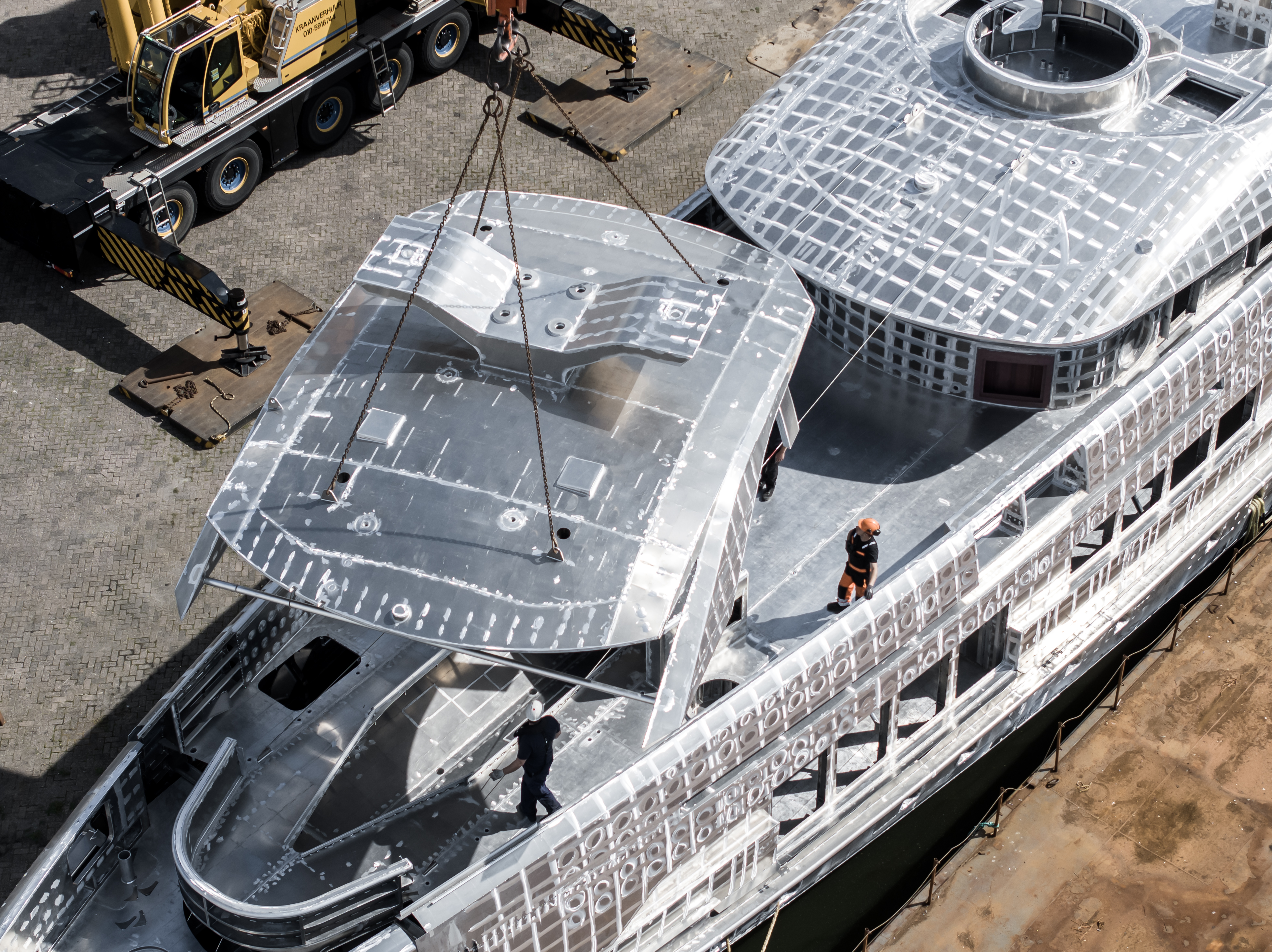 The skeleton of silent superyachts being constructed using cranes at Heesen.