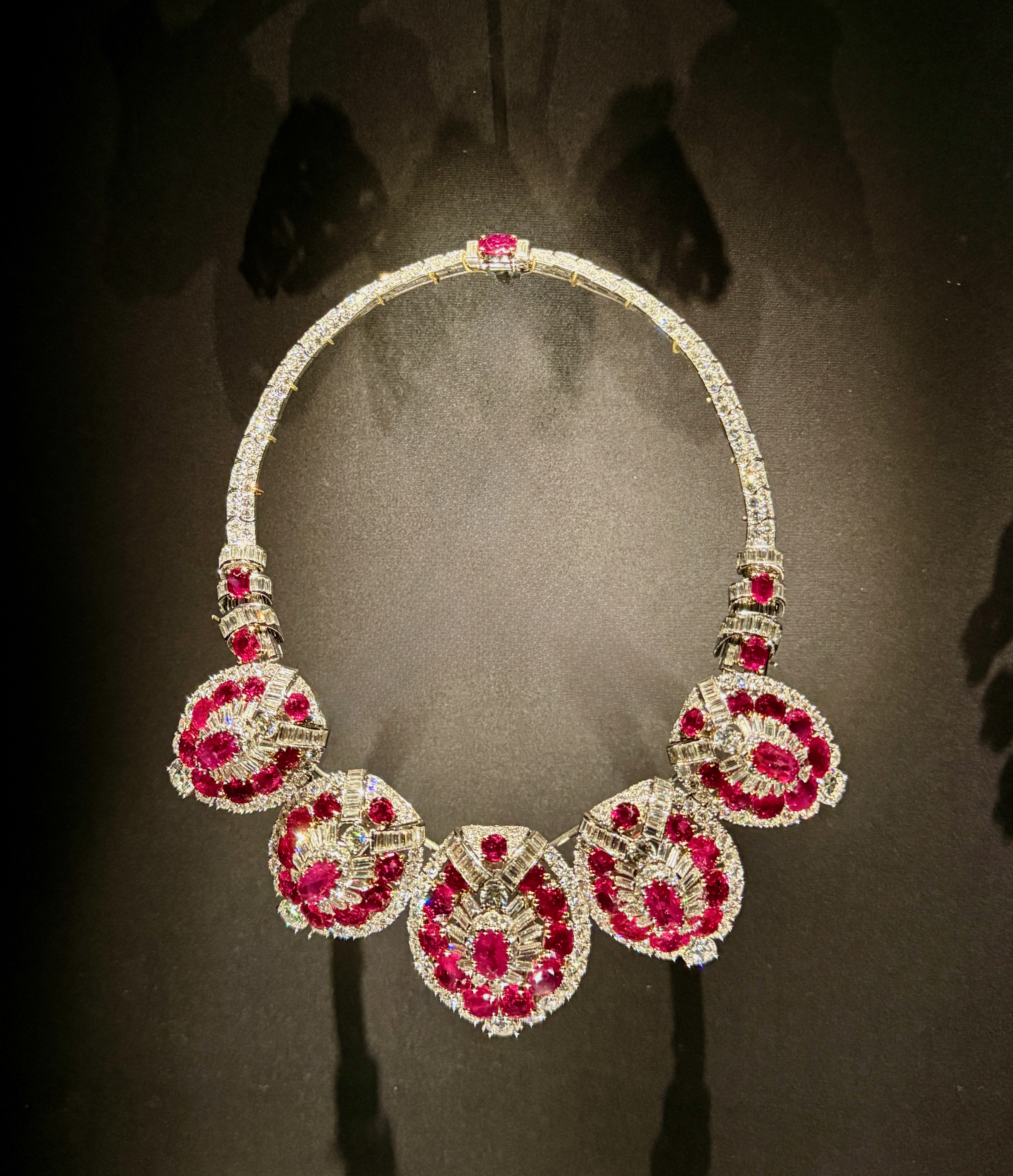 A ruby and diamond structured necklace by Cartier on display at the V&A.