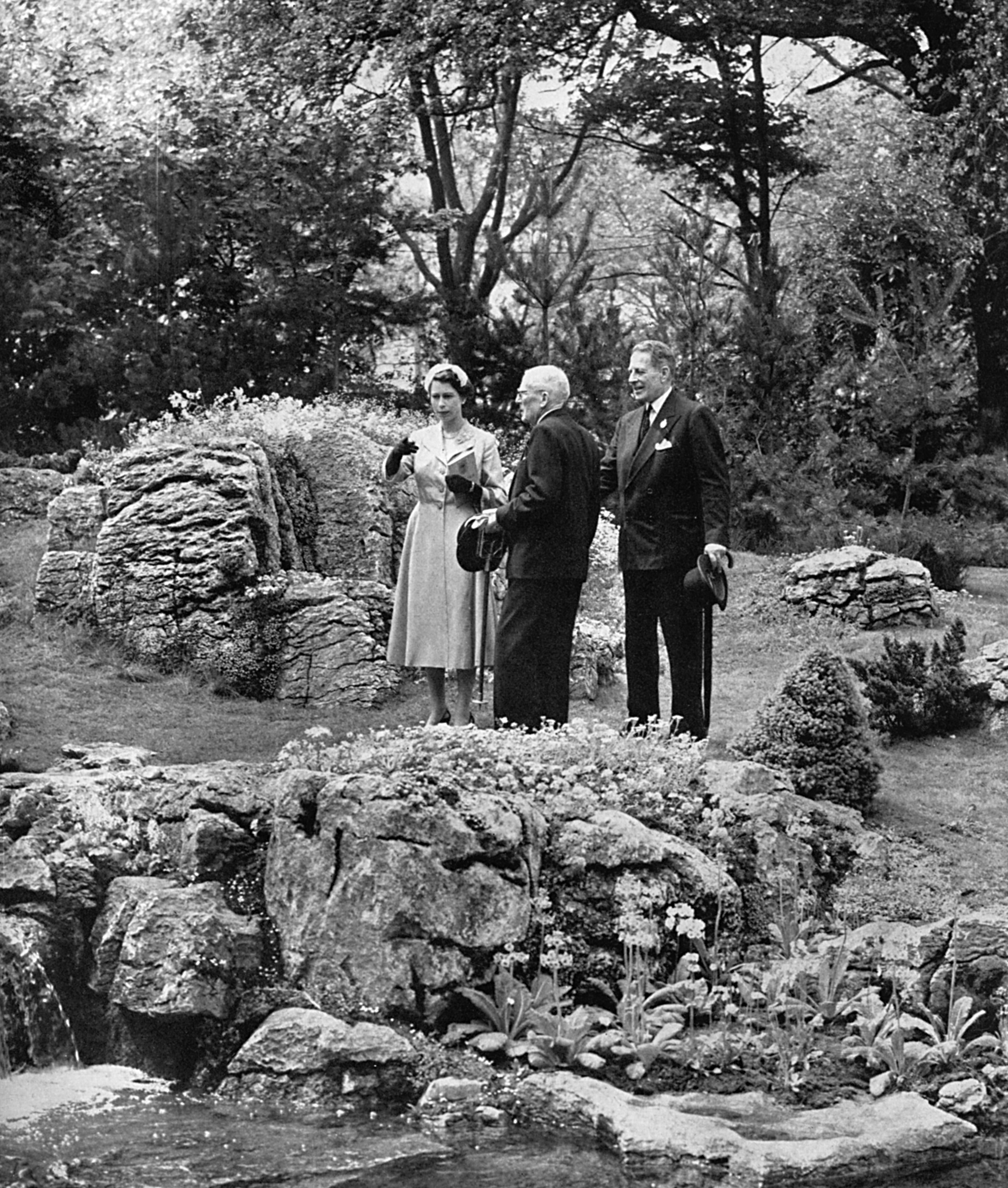 An archive image of Queen Elizabeth II at the Chelsea Flower Show in 1955, displaying the Royal History of Chelsea Flower Show.
