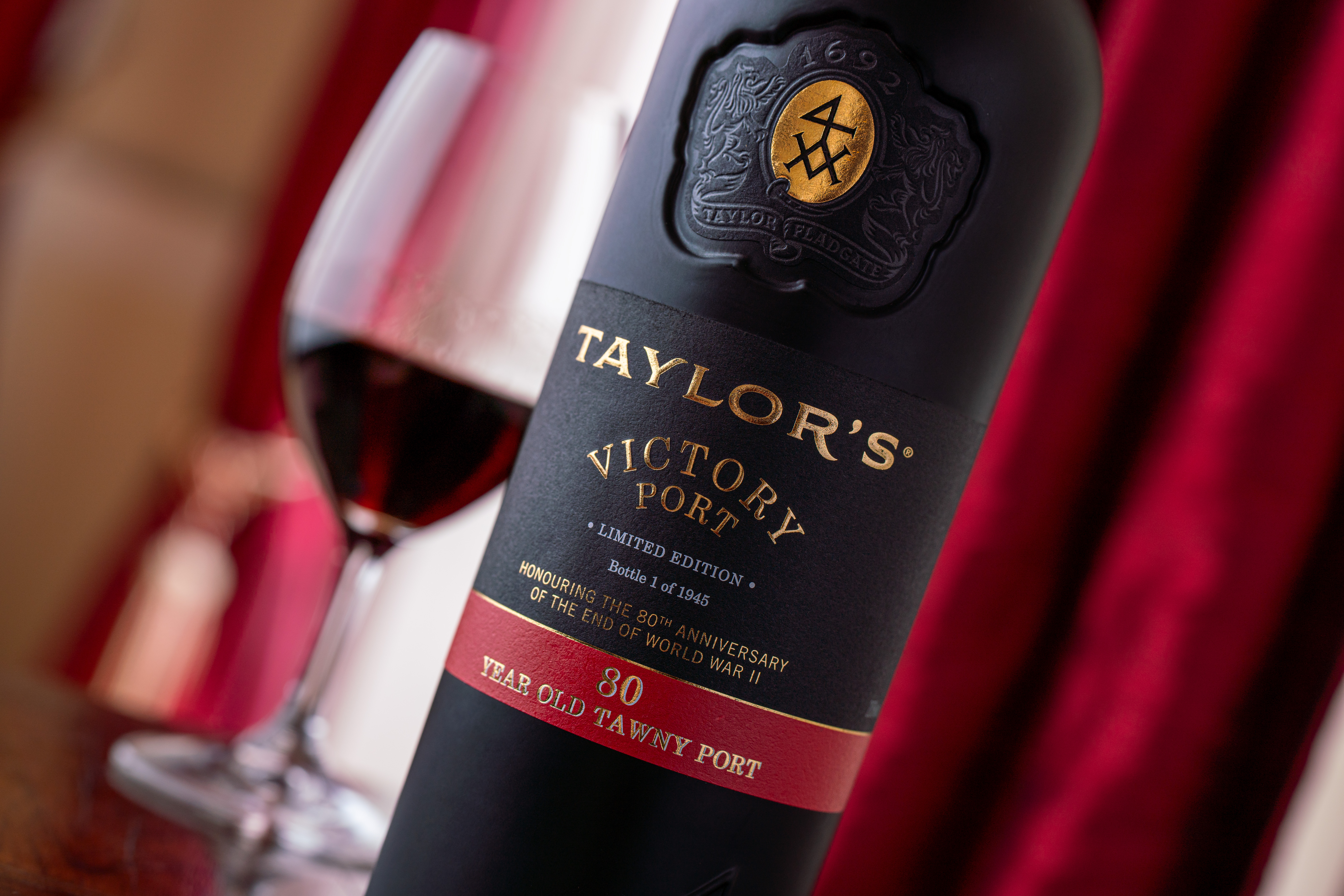 A bottle Taylor's Victory Port alongside a glass of the 80-year-old Port.
