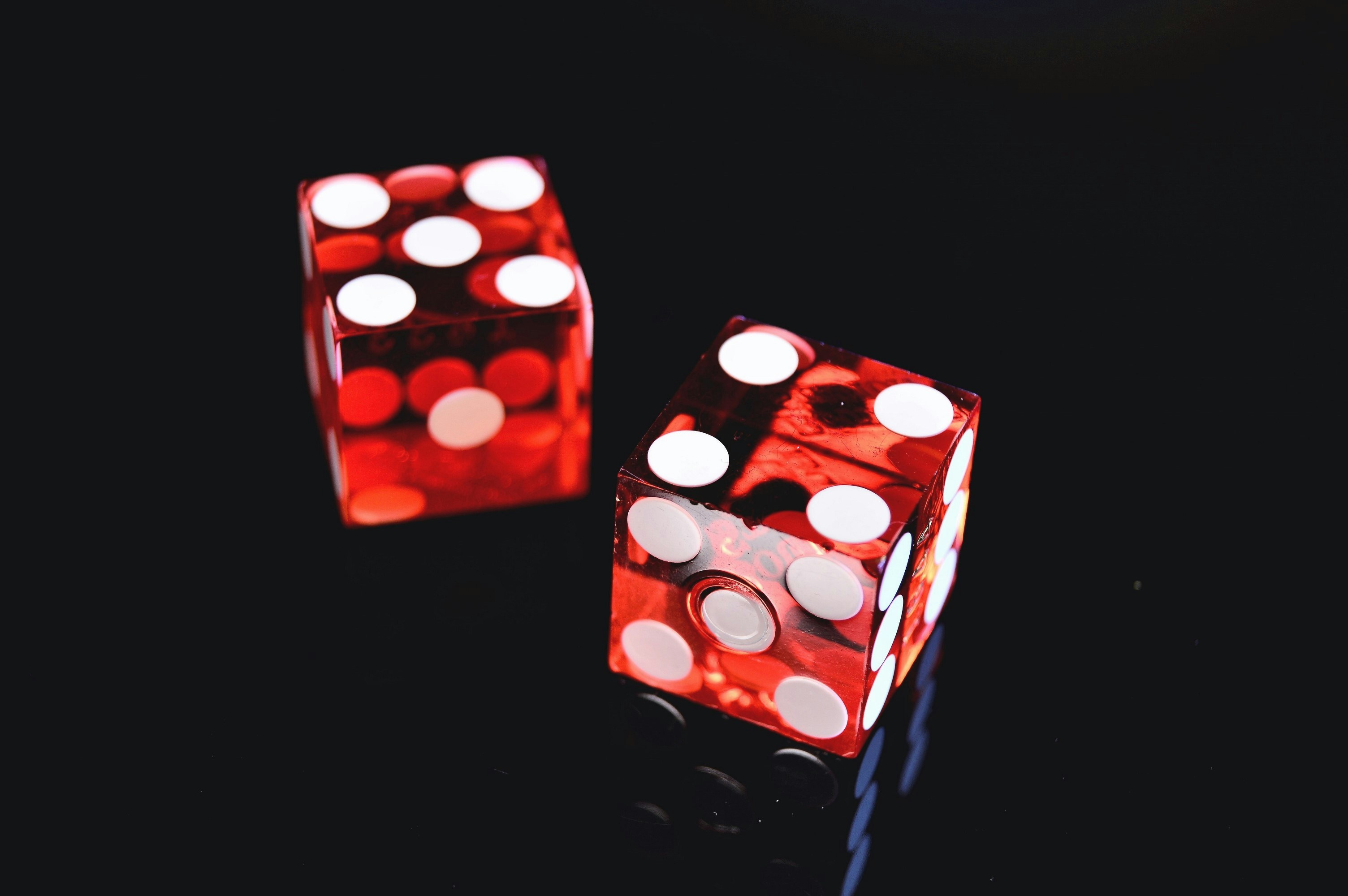 A pair of red dice as The Conversation by David Spiegelhalter discussed matters of probability.