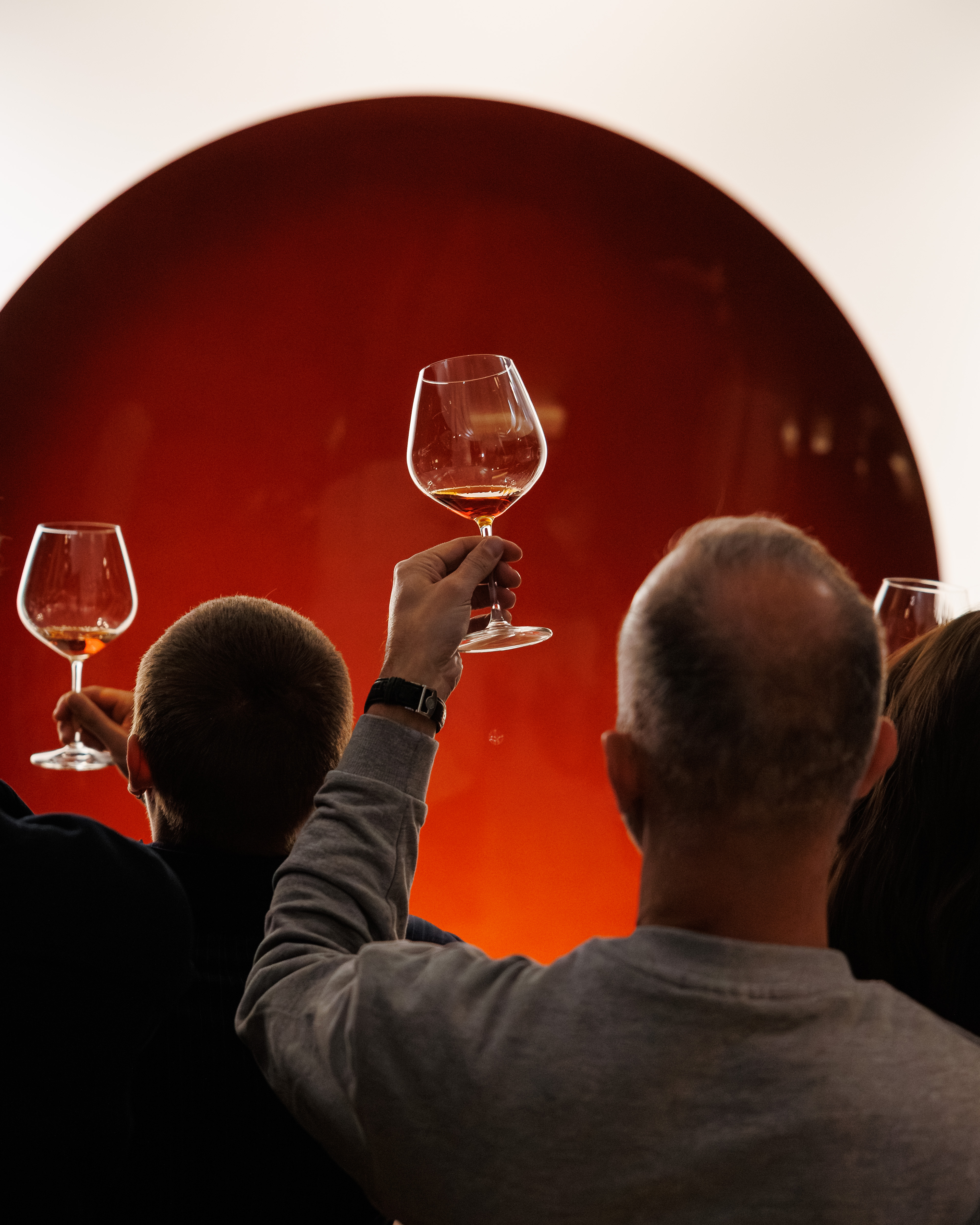 Guests lifting glasses of XO at the Rémy Martin Anish Kapoor launch.