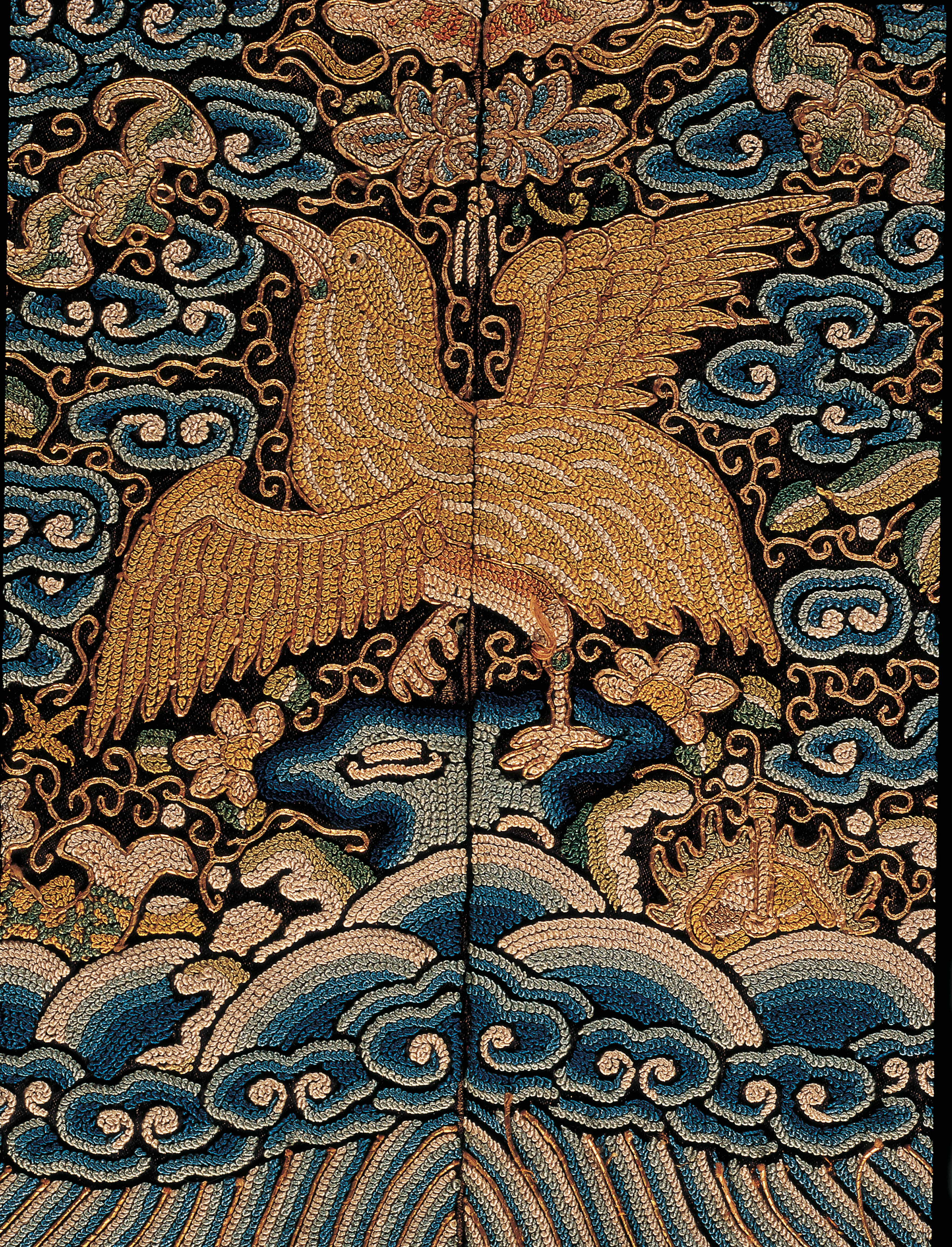 Embroidered birds on display at Textiles: The Art of Mankind.