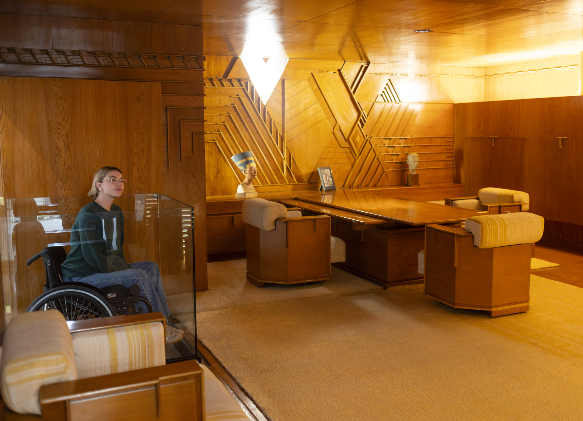 Woman looks at Frank Lloyd Wright's 1930s Office design, part of the V&A East Storehouse collection