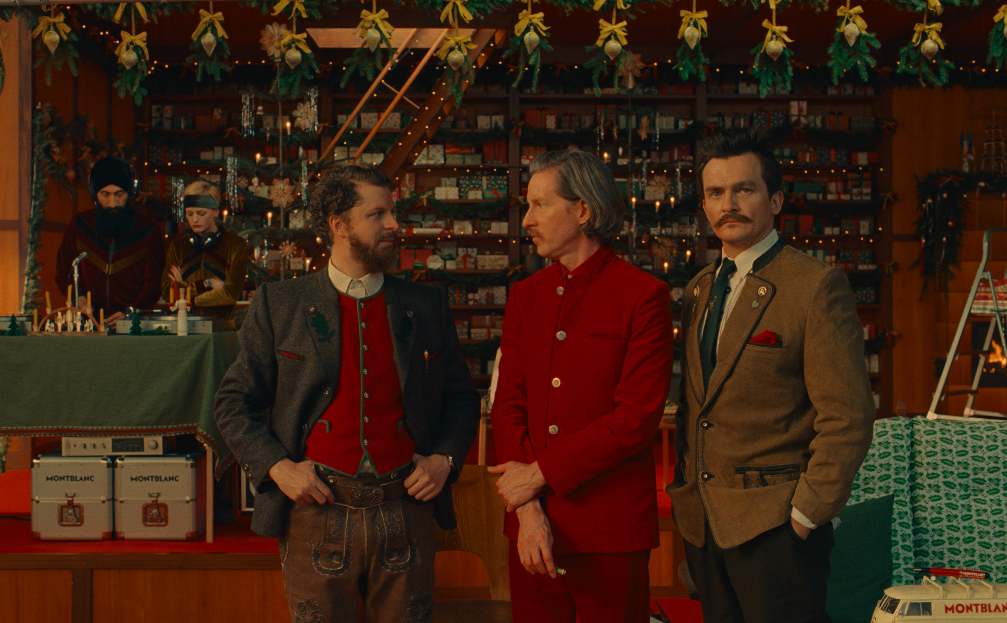 Anderson, Cera and Friend travel into a workshop decorated for the Christmas season in Wes Anderson's campaign short "Let's Write" for Montblanc.