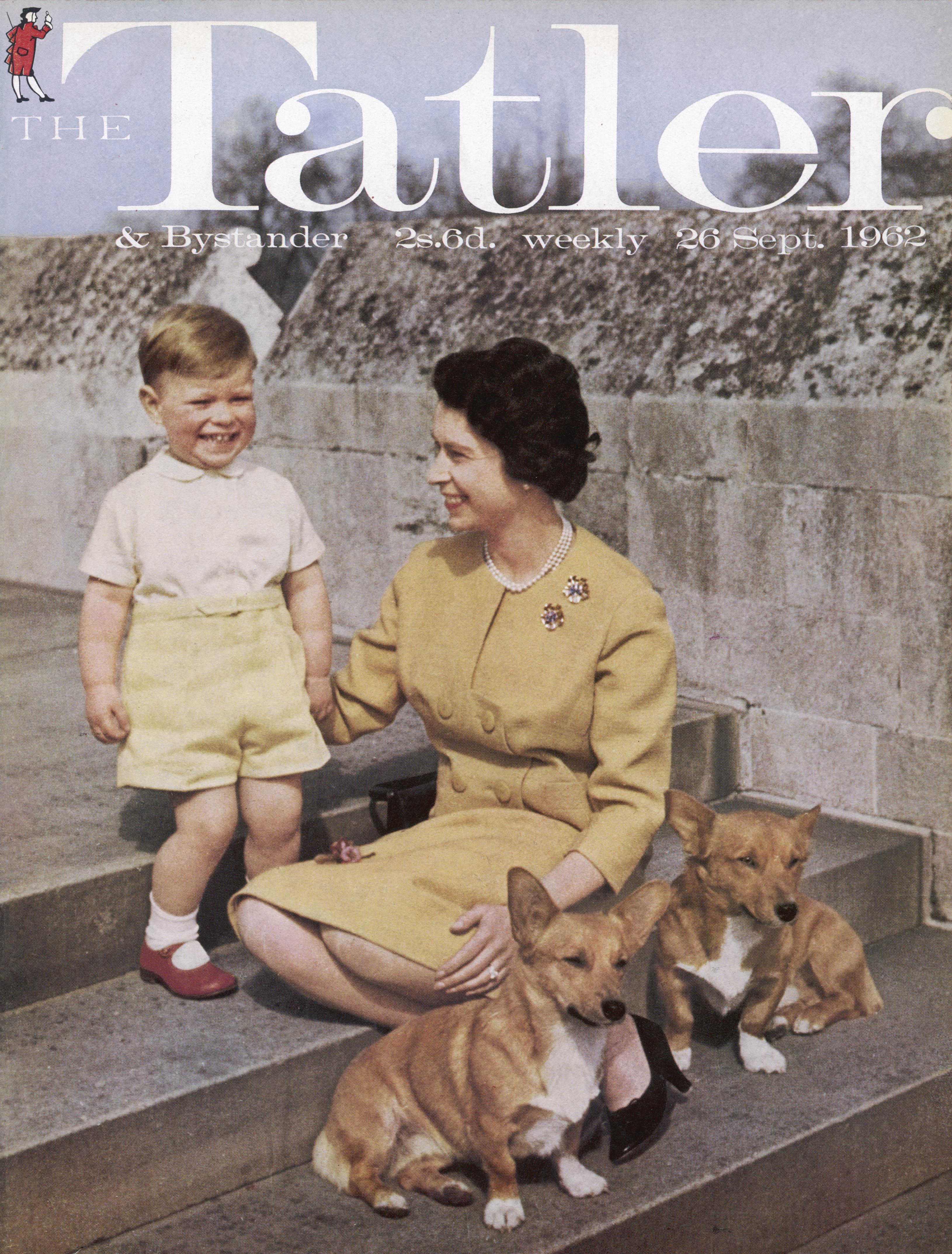 In this moment from the history of royal dogs, Queen Elizabeth II is seen with a two-year-old Prince Andrew and a pair of her corgis