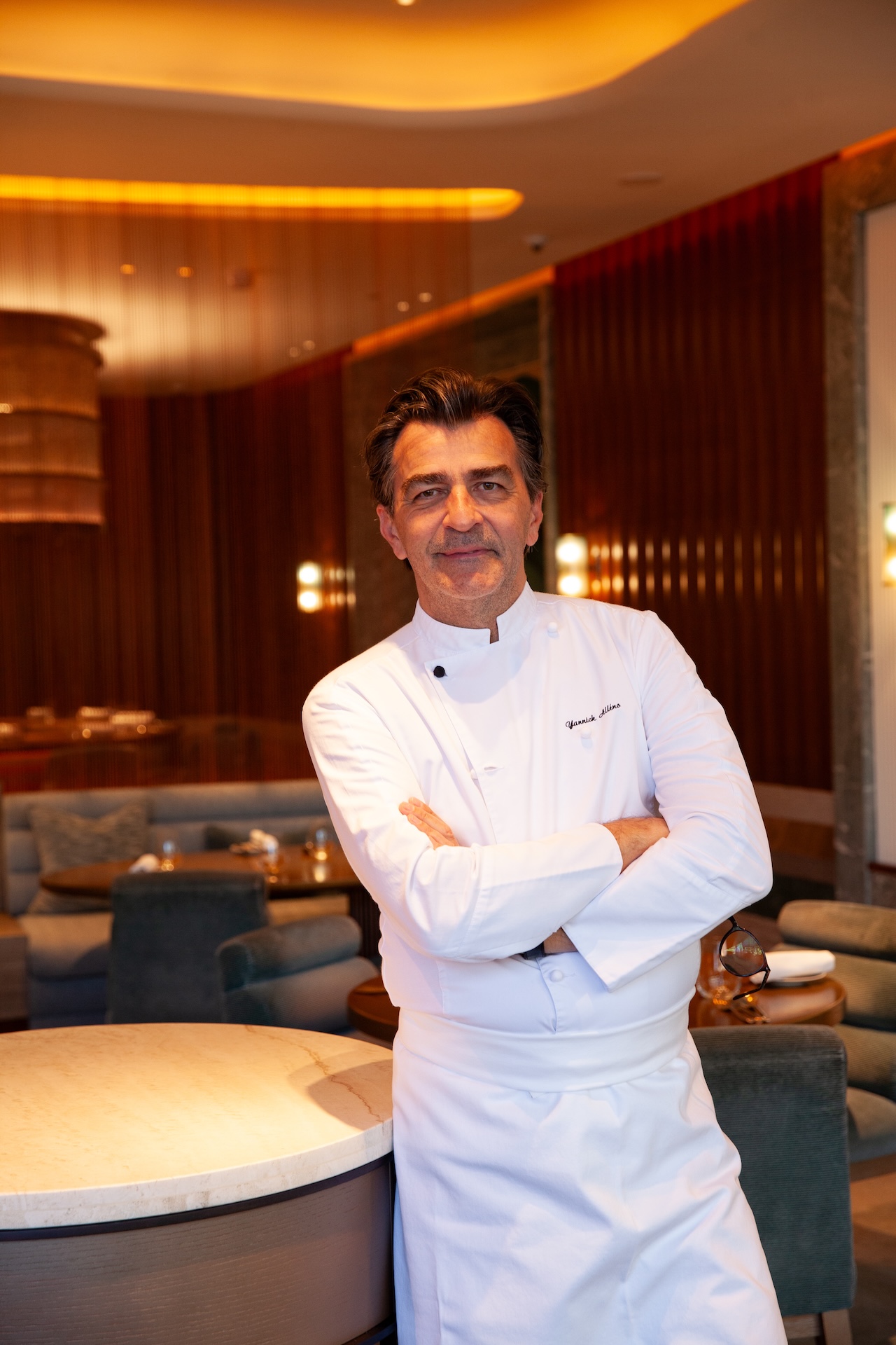 Yannick Alléno stood in the restaurant space of Pavyllon.