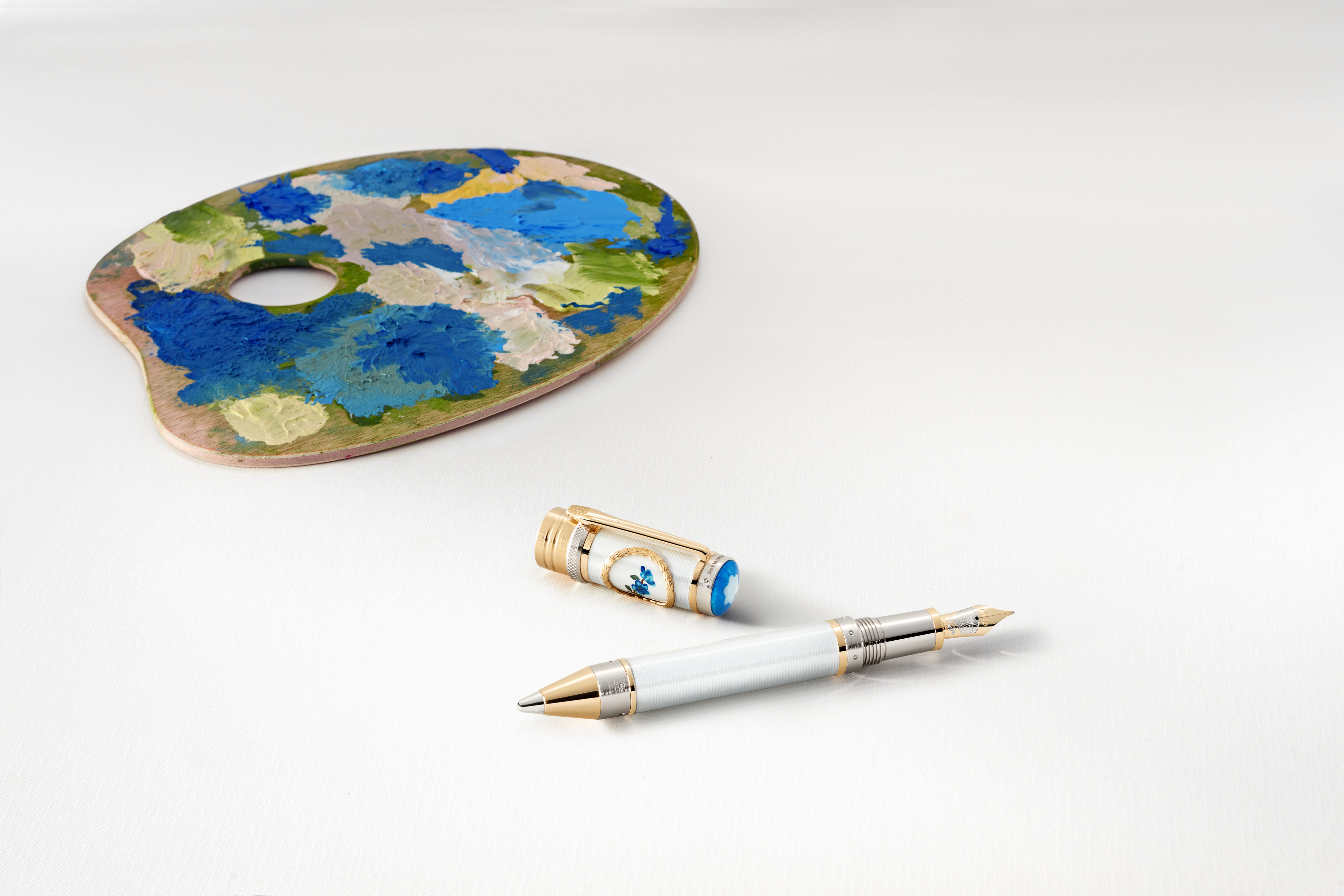 Montblanc’s Renoir Pen combines lacquer, pearl and olive wood accented by ultramarine blue.