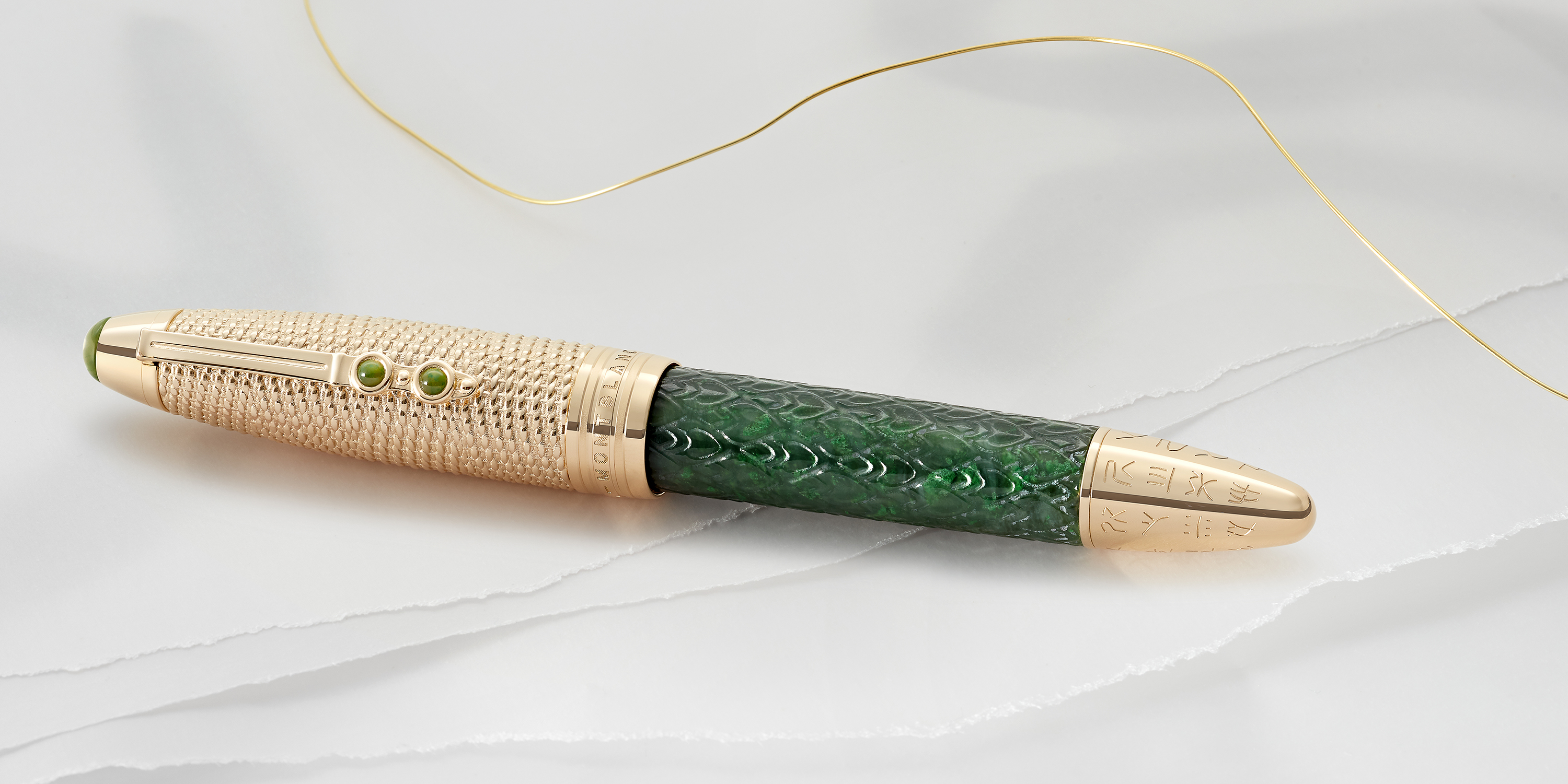 Montblanc’s Meisterstück Pen with intricate jade and script detailing.