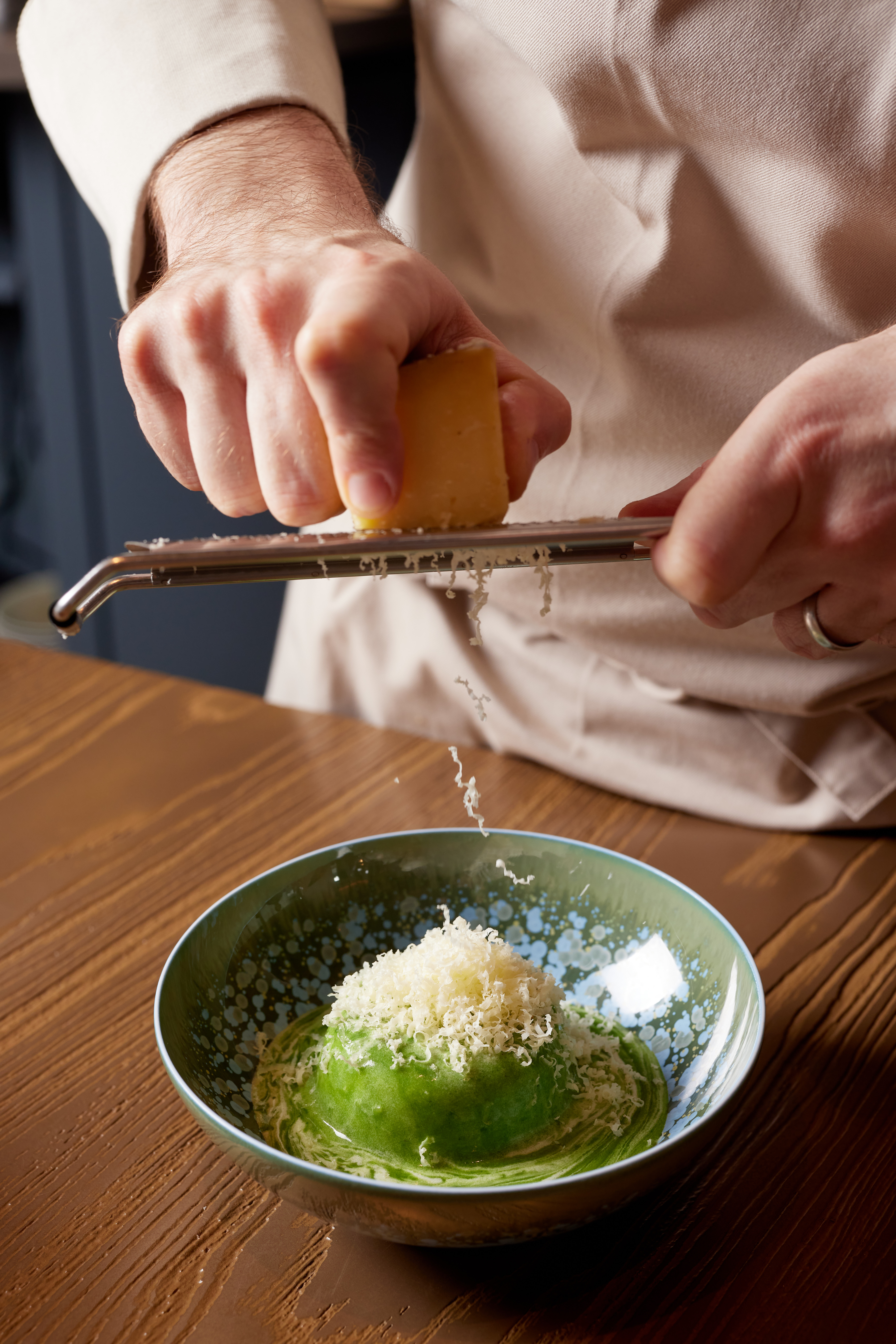 A Cheese Souffle being topped with cheese by Yannick Alléno at Pavyllon.