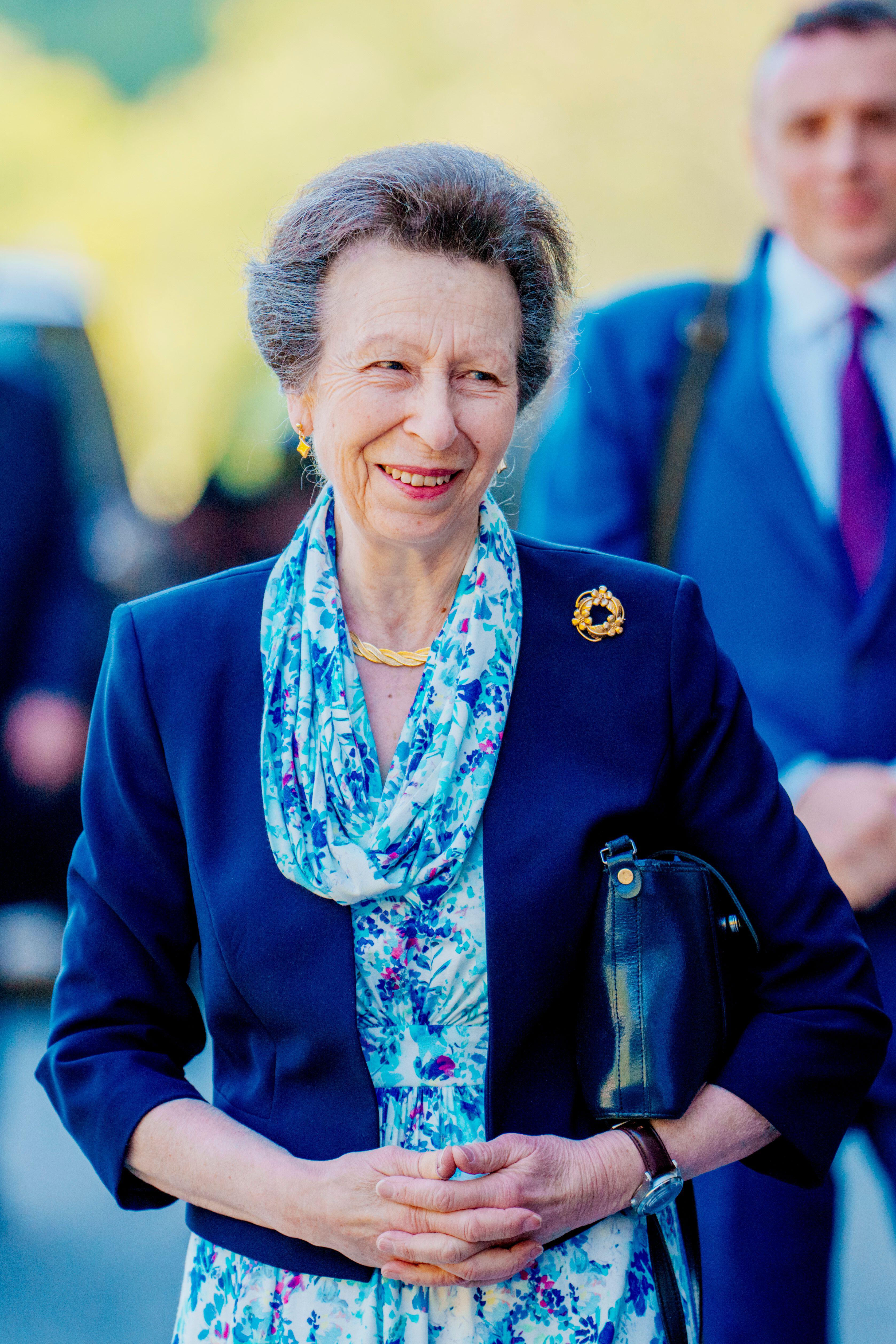 The Princess Royal smiling, holding her handbag - Princess Anne 75th birthday.