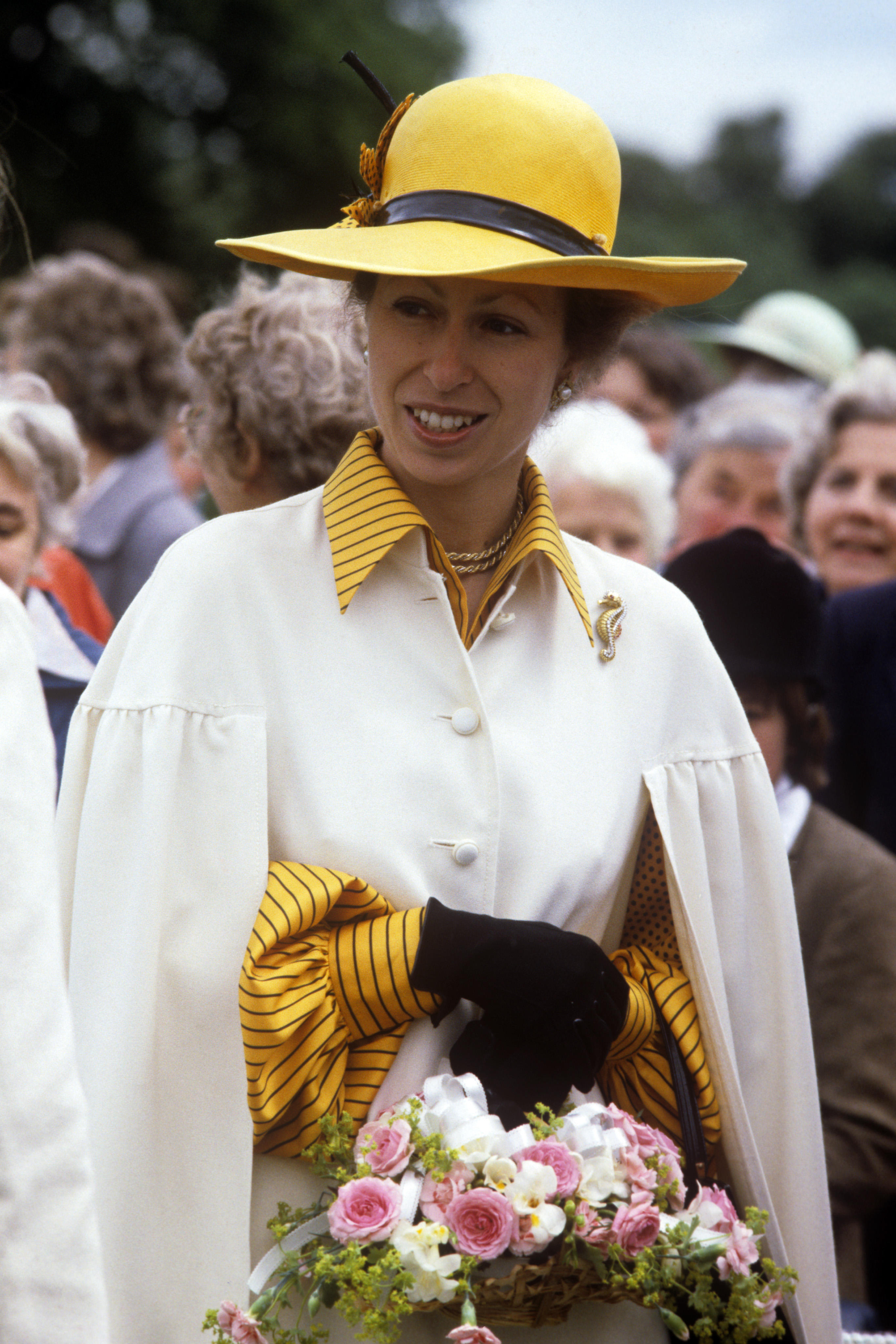 The Princess holding flowers, visiting the Riding for the Disabled Association in 1983. 