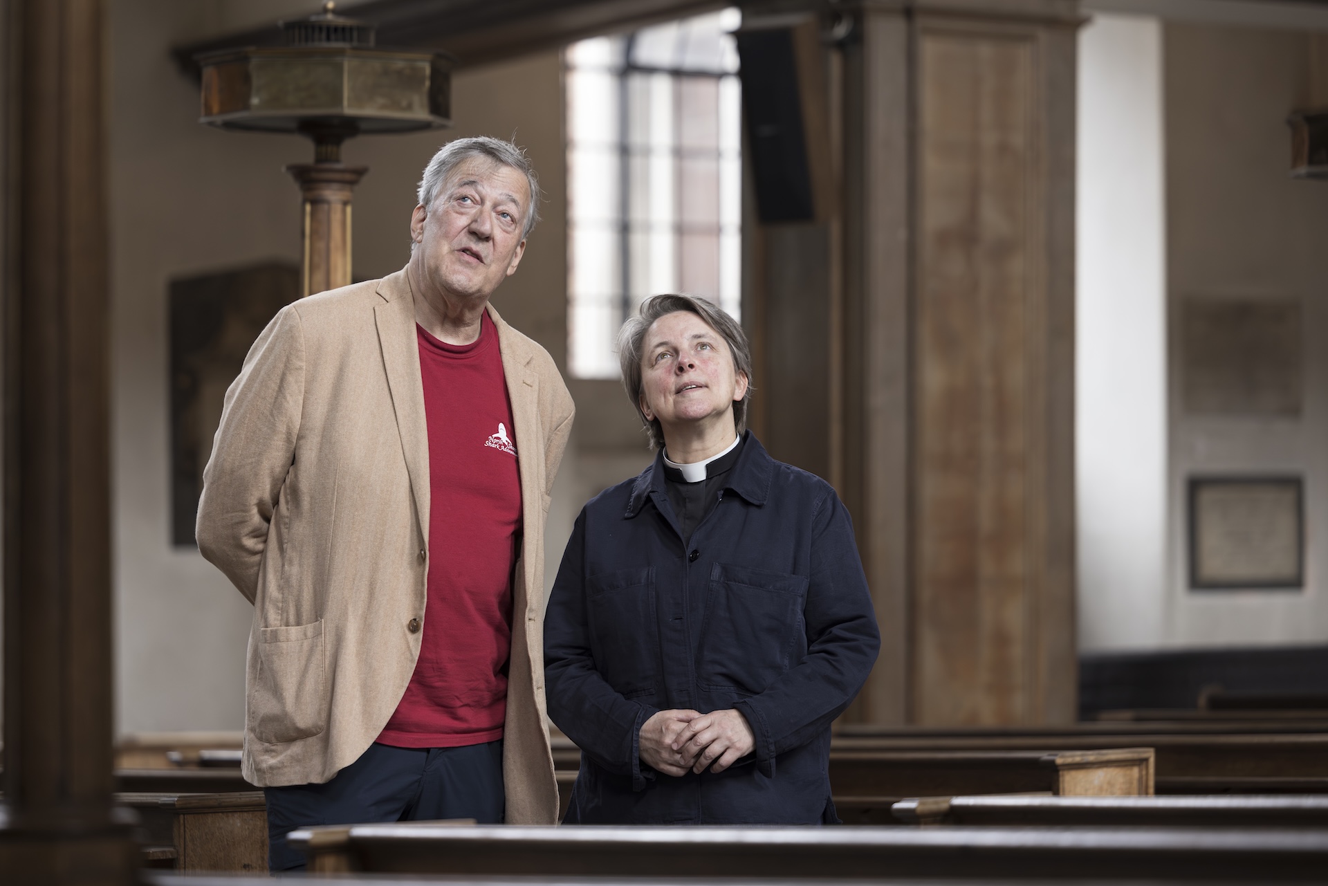 Stephen Fry and Lucy Winkett gazing up at the ceiling of St James's Church Piccadilly.