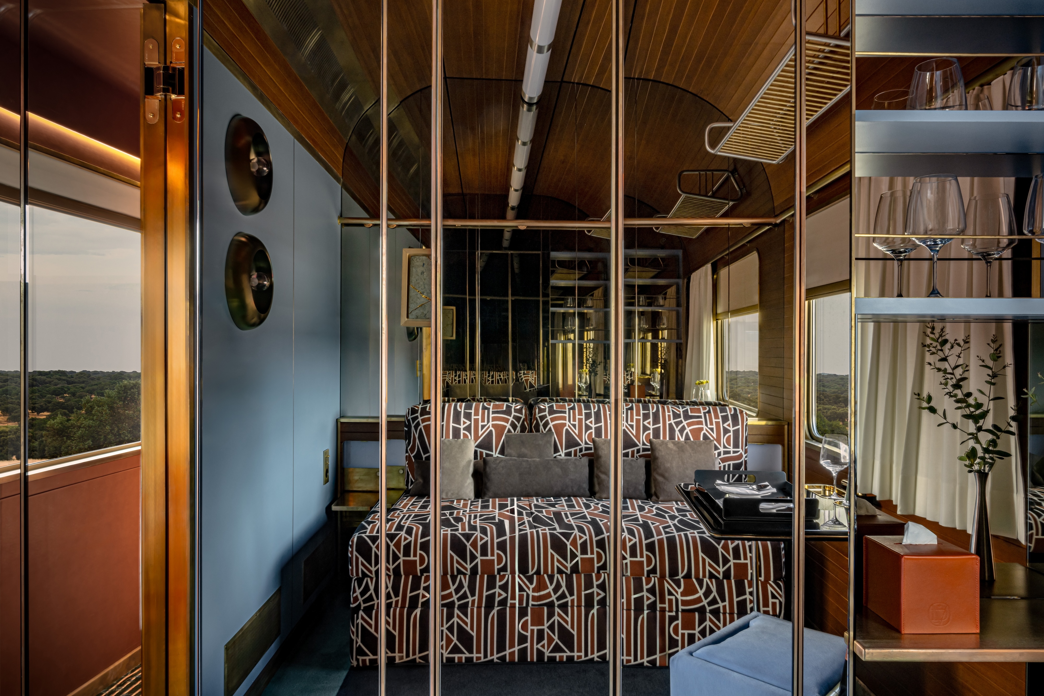 La Dolce Vita Orient Express' luxury rail travel deluxe cabins with modernist textiles and smoked mirrors.