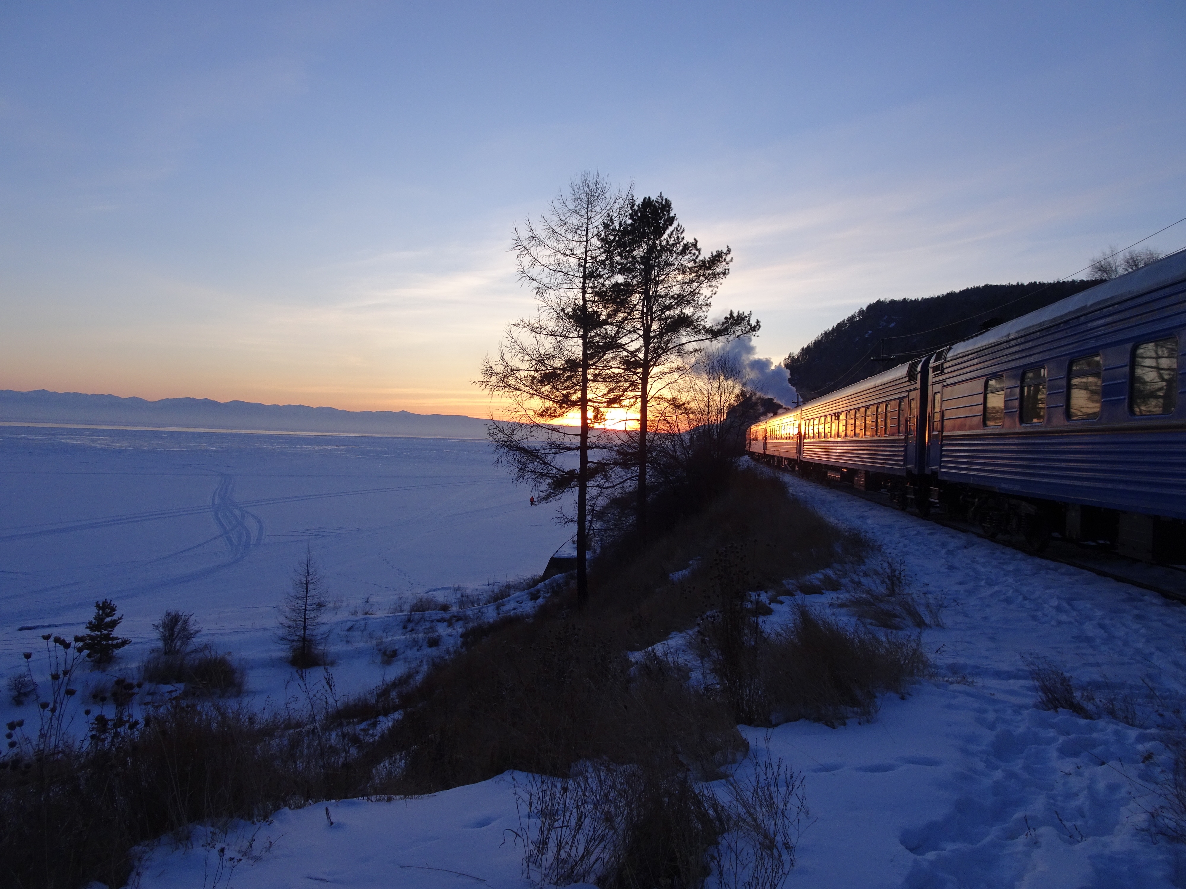 Luxurious travel sunset on Baikal seen from the rail train, Golden Eagle Silk Road Express.