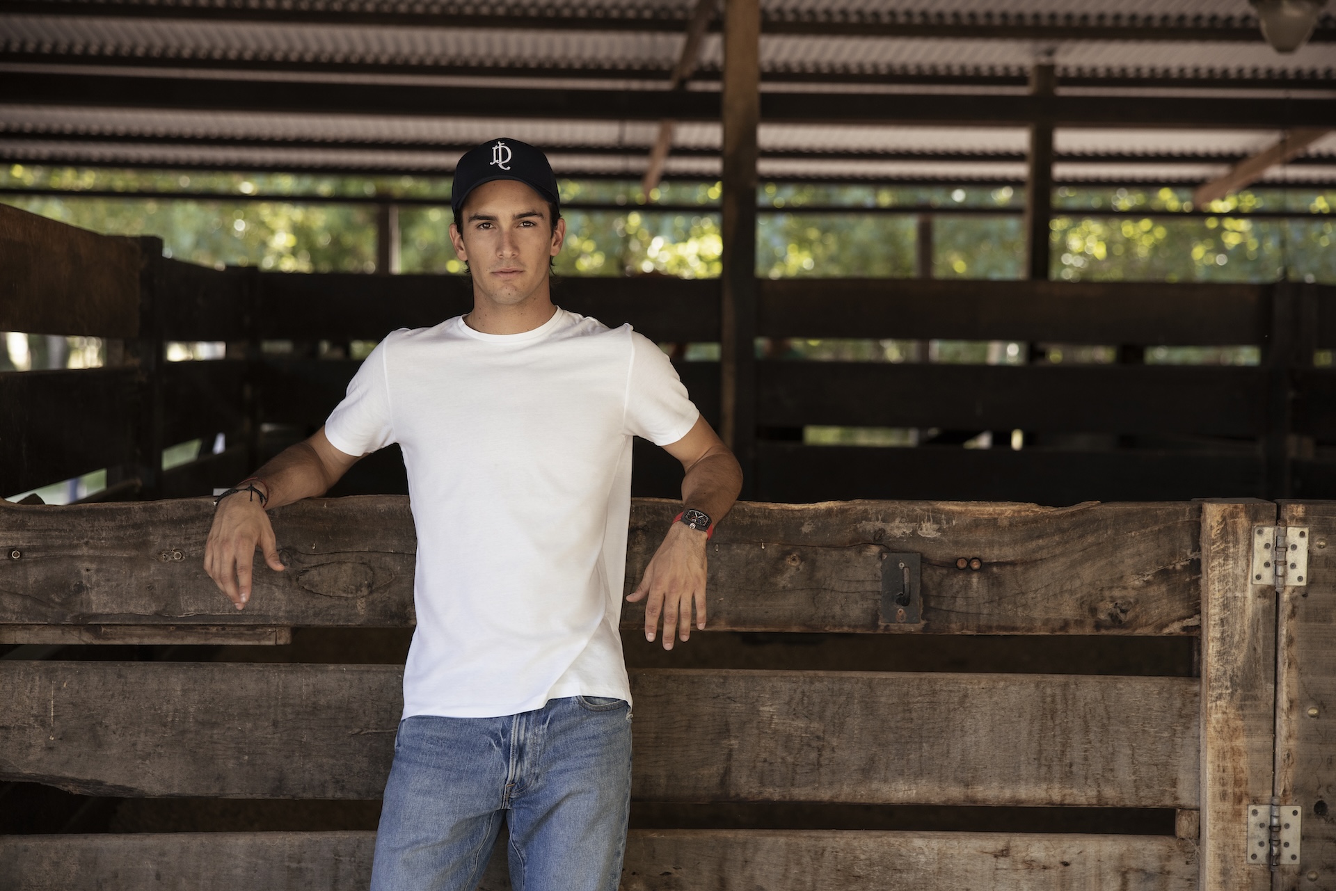 Poroto Cambiaso standing in the stables. 