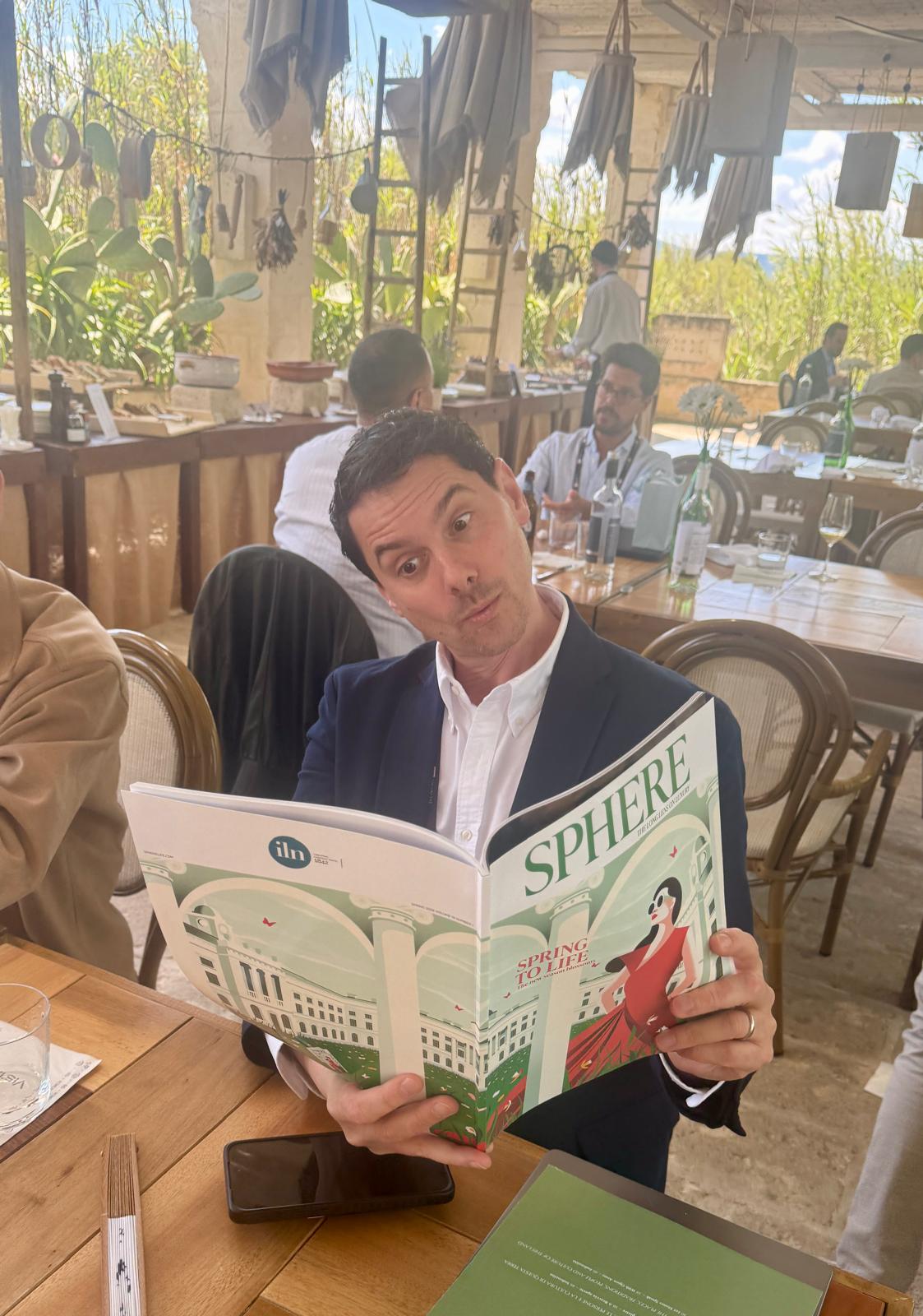 FT Business of Luxury Summit - SPHERE Magazine being read. 