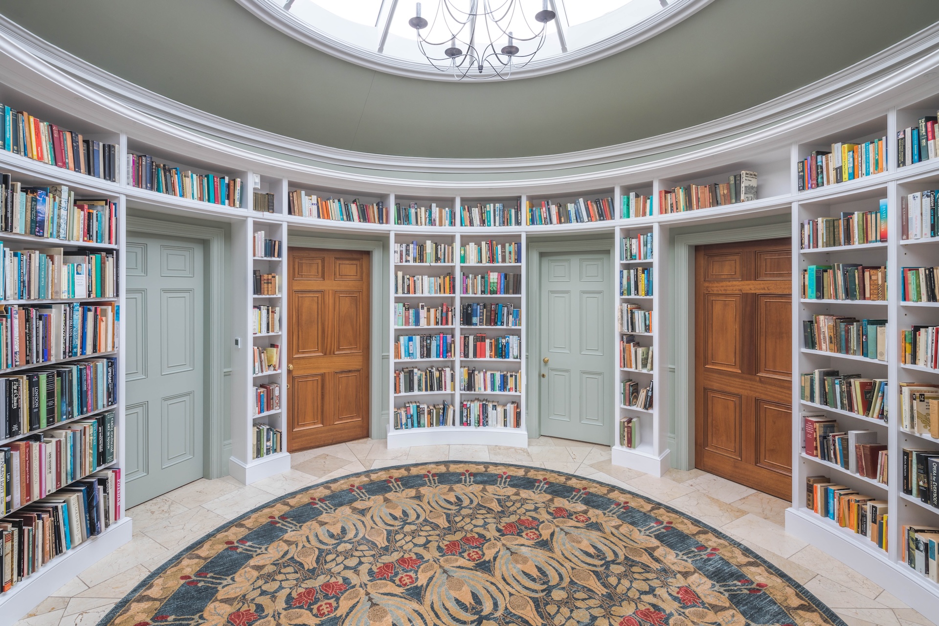 Circular library space lined with curved bookshelves.