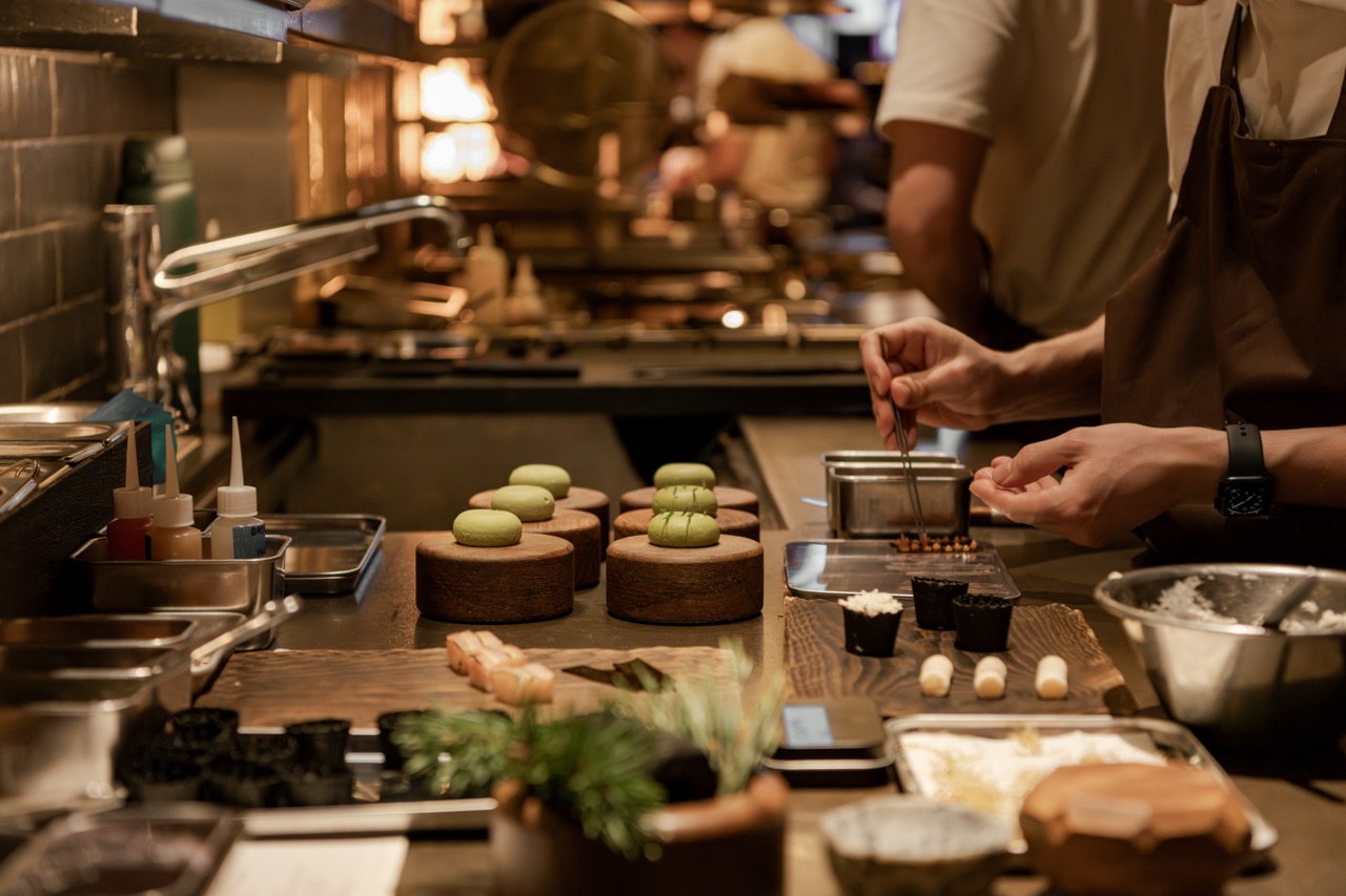 Food prep in the upstairs, open-fire kitchen. 