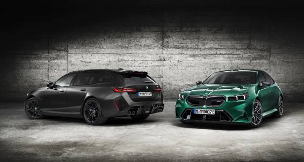 Investment, Tech & Motoring trends 2025 - A matte black BMW M5 Touring and a vibrant green BMW M5 Touring are showcased in an industrial setting, highlighting their sporty design and bold features