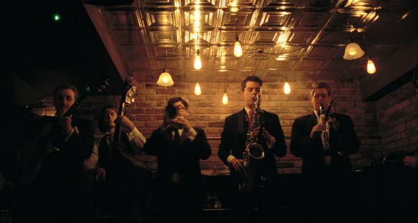 Five piece band performing at London jazz club, Nightjar.
